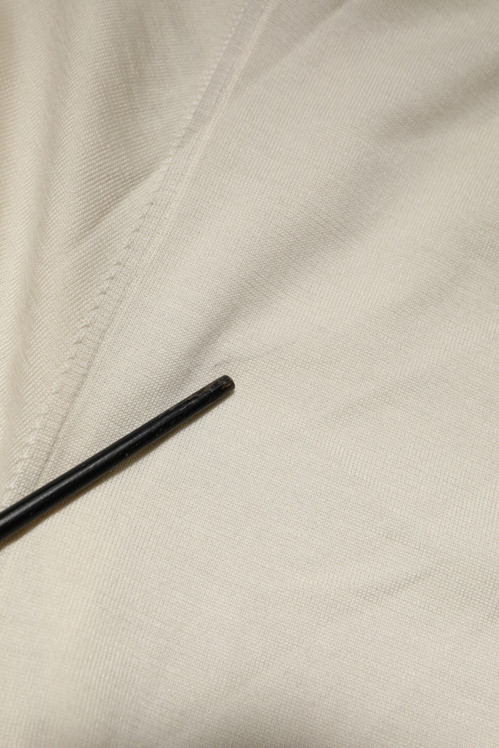 Black pen on white fabric