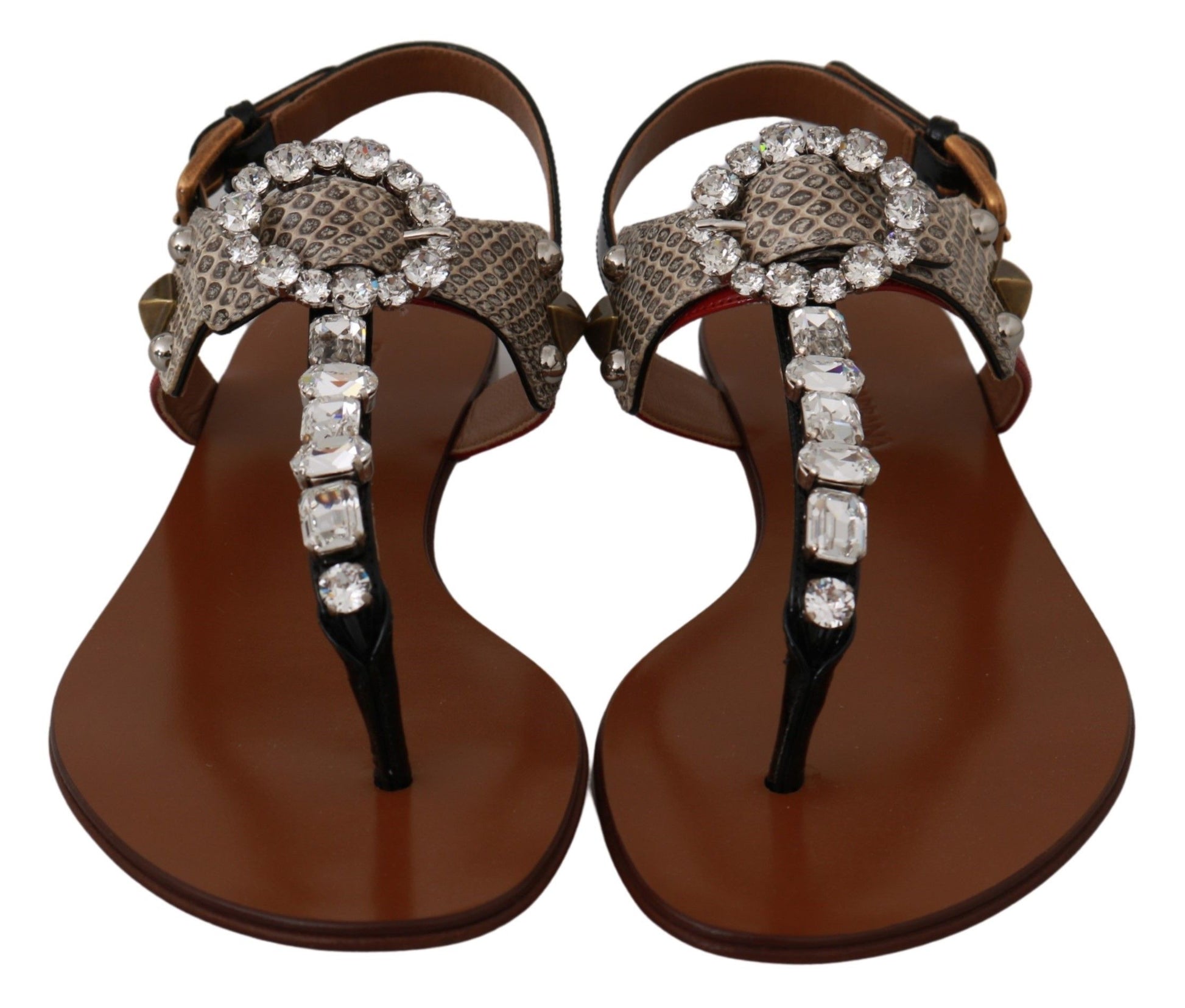 Pair of brown sandals with embellishments and straps