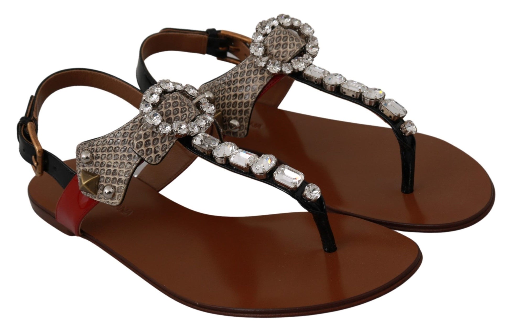 Pair of brown sandals with embellishments and straps