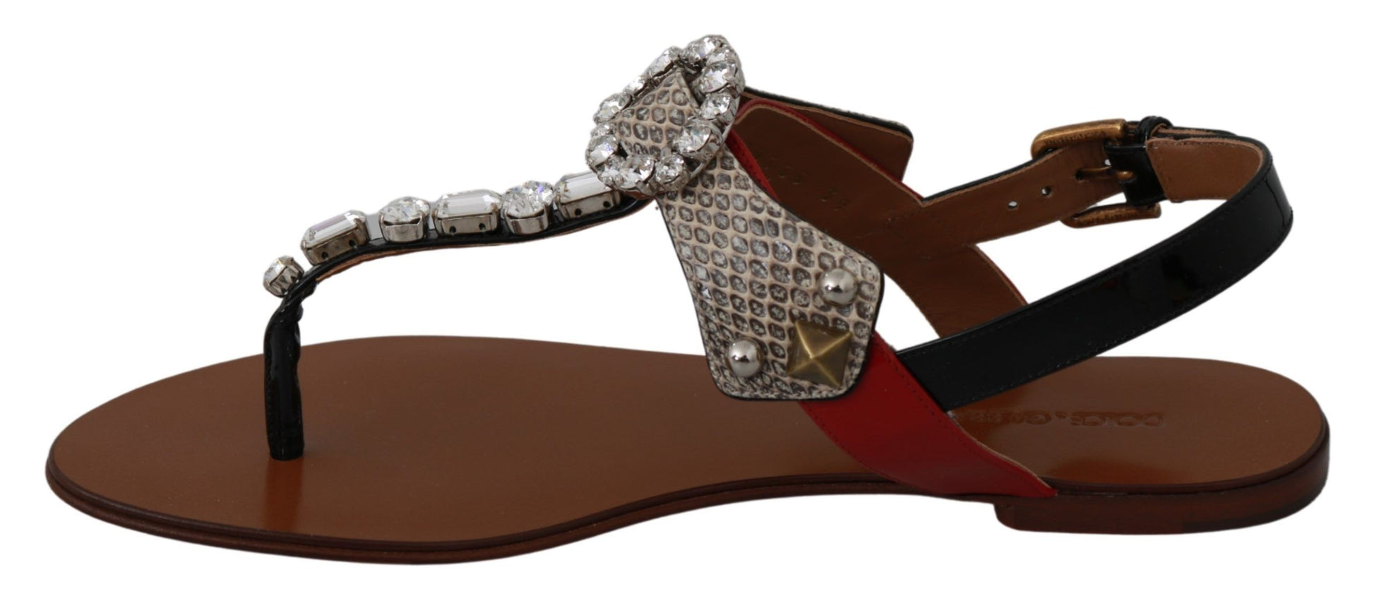 Pair of brown sandals with rhinestones and a red band