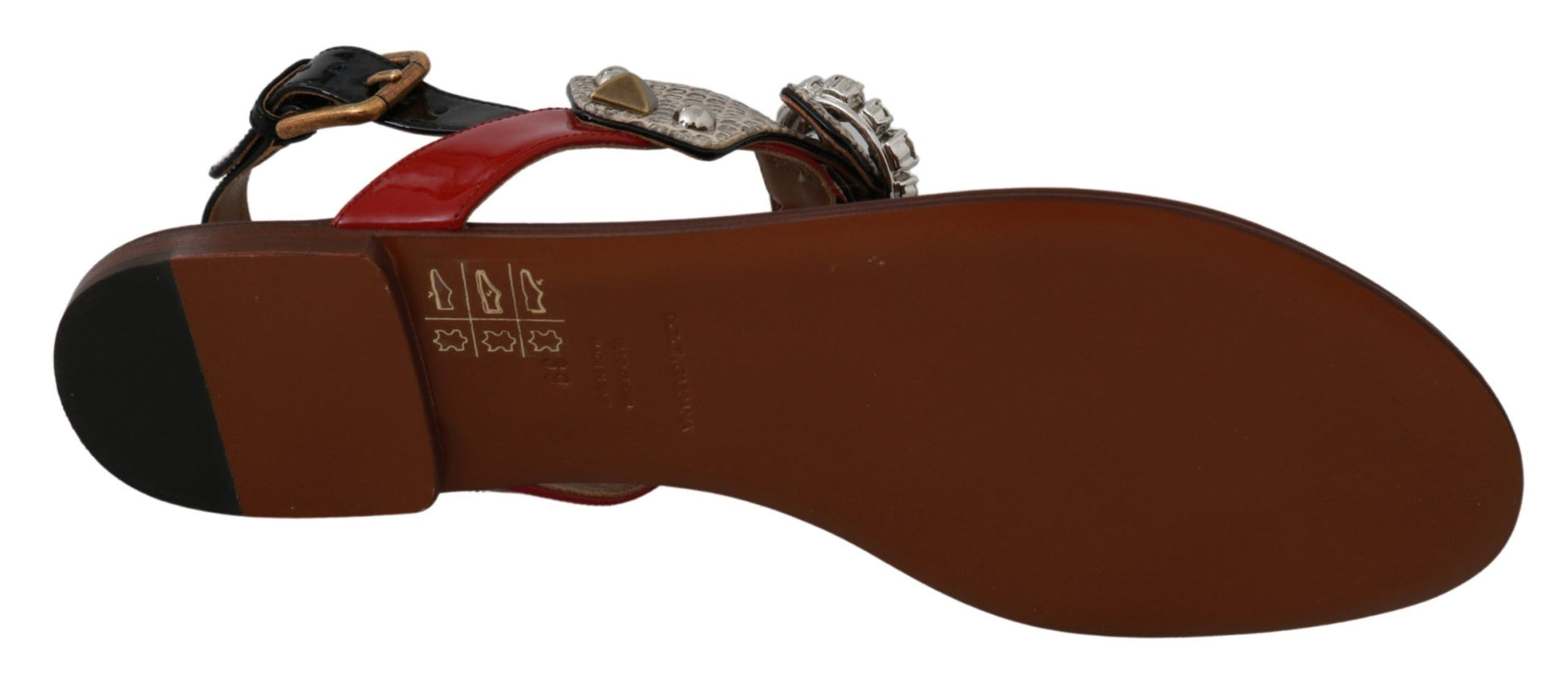 Pair of brown sandals with red straps and buckles