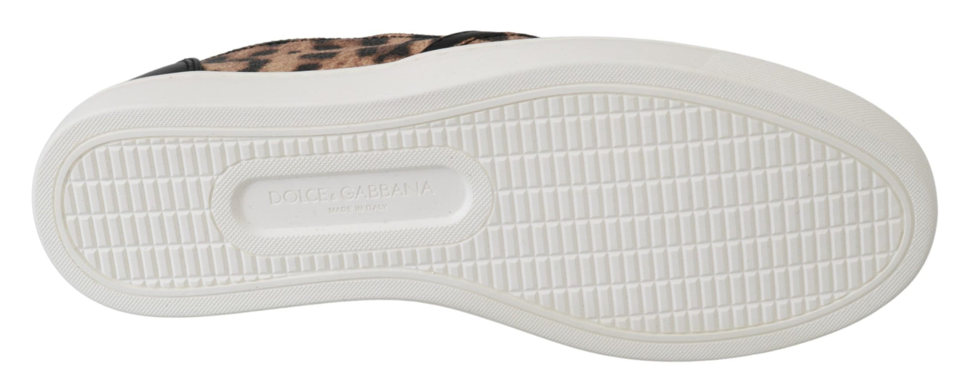 Pair of white sneakers with patterned soles