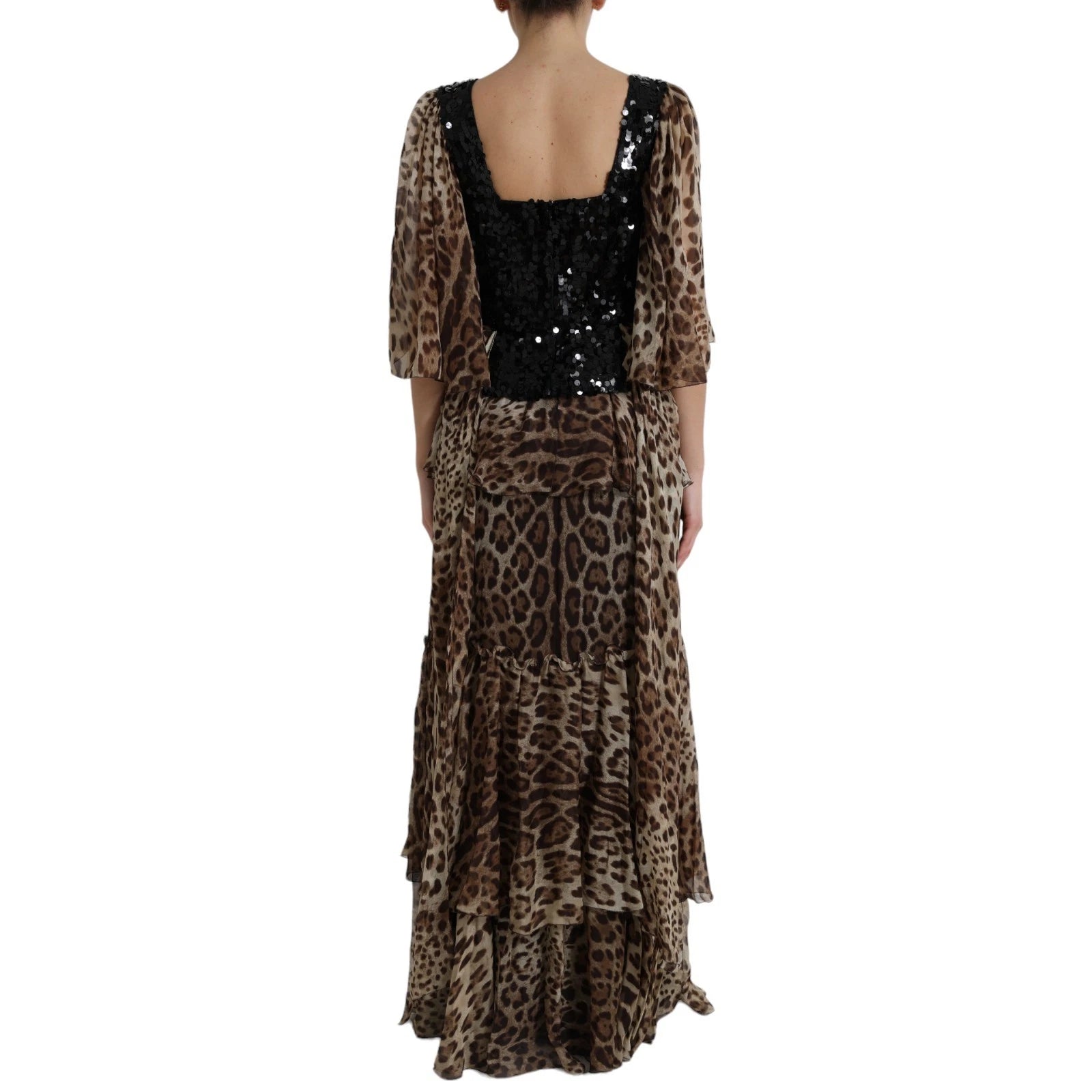 A long, sleeveless dress with a leopard print and sequin ruffles