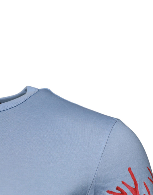 Blue sleeveless shirt with red design on shoulder