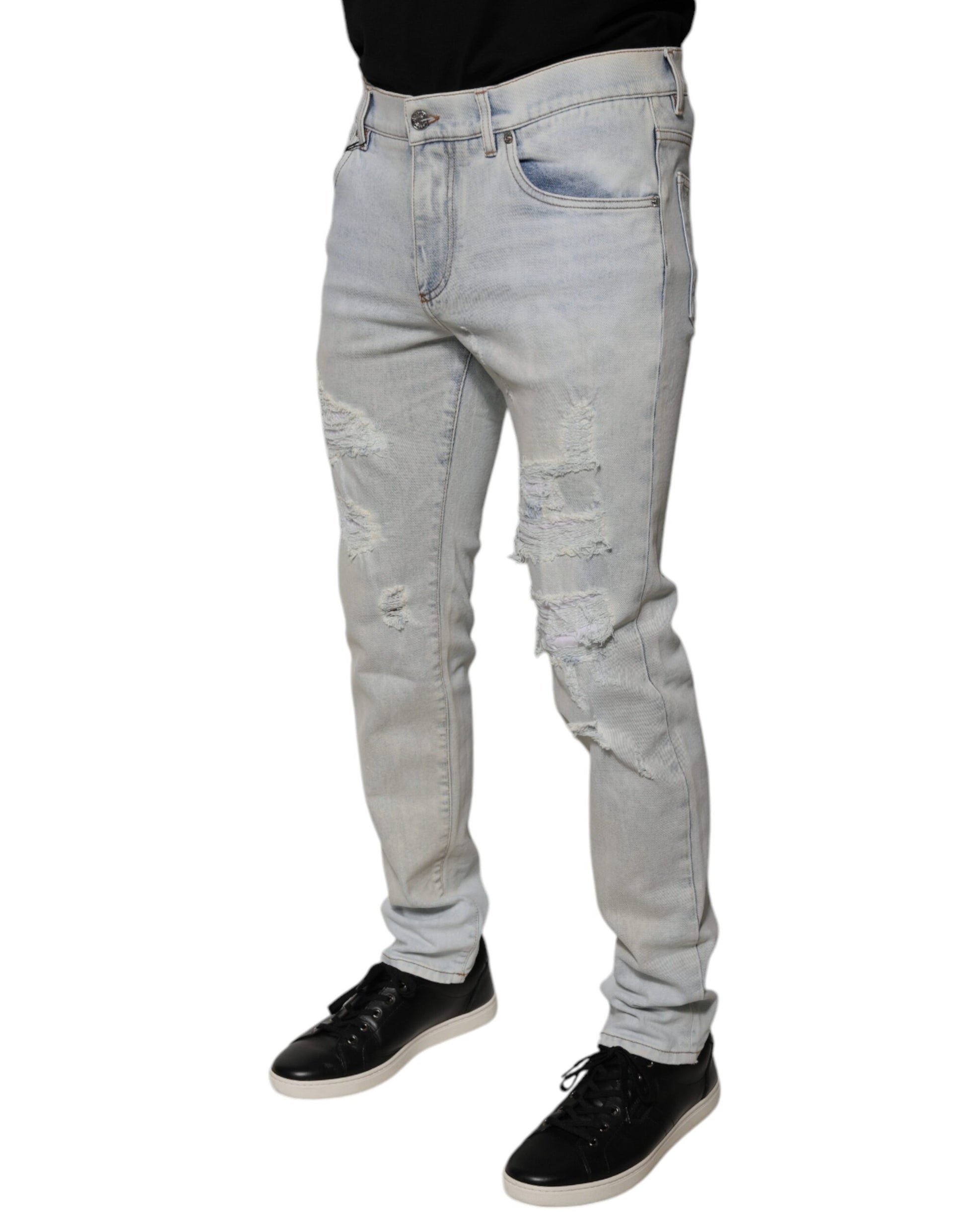 Man wearing blue jeans and black shoes