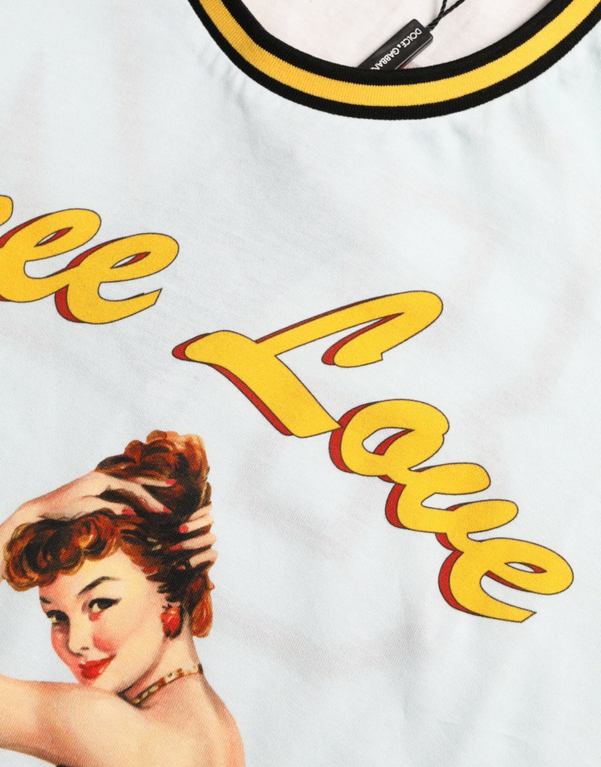 White t-shirt with red lettering and a woman's face on front