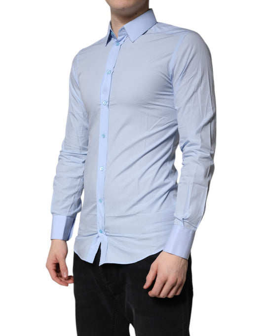Men's light blue cotton dress shirt with long sleeves and gold accents