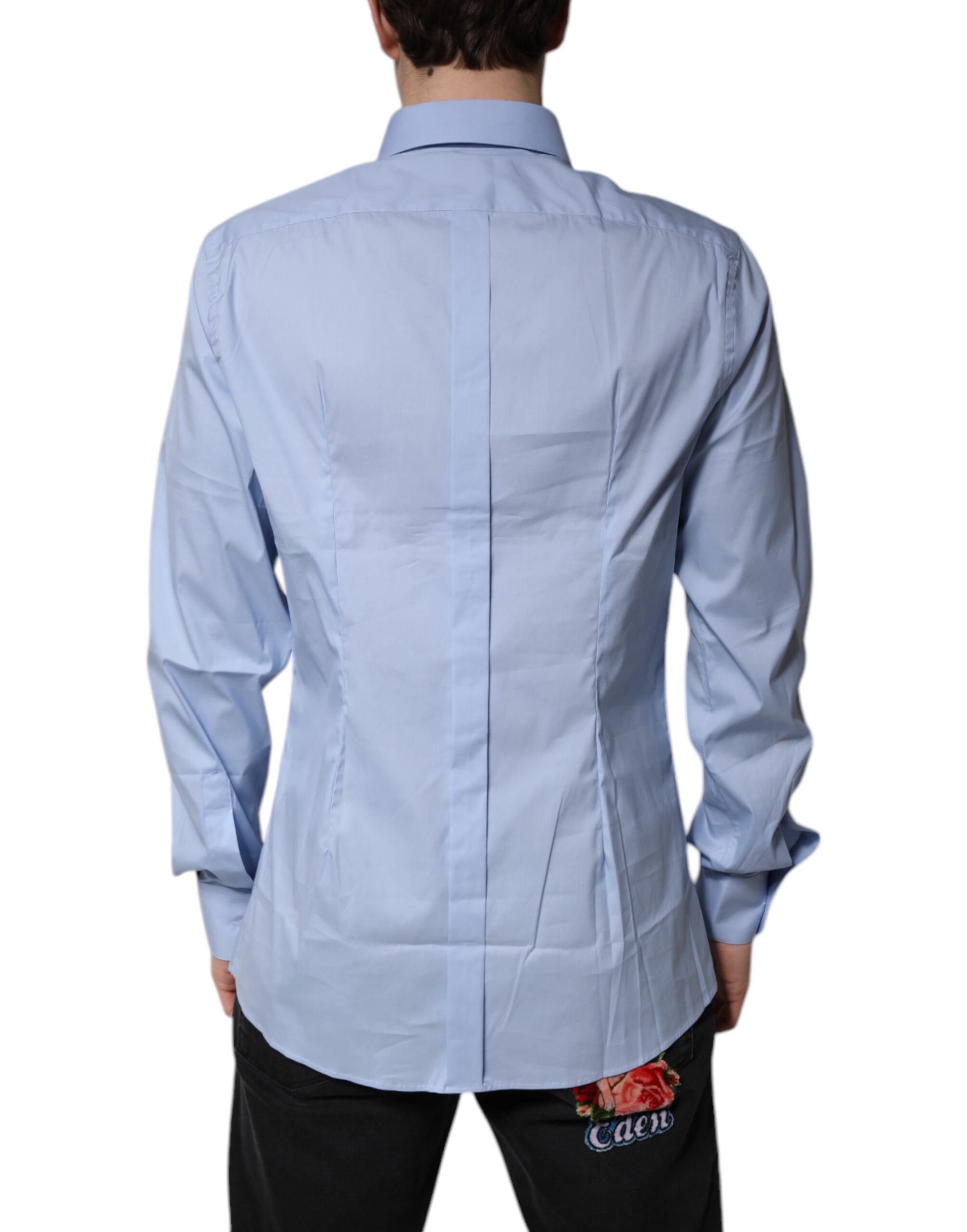 A light blue cotton dress shirt with a gold design on the back