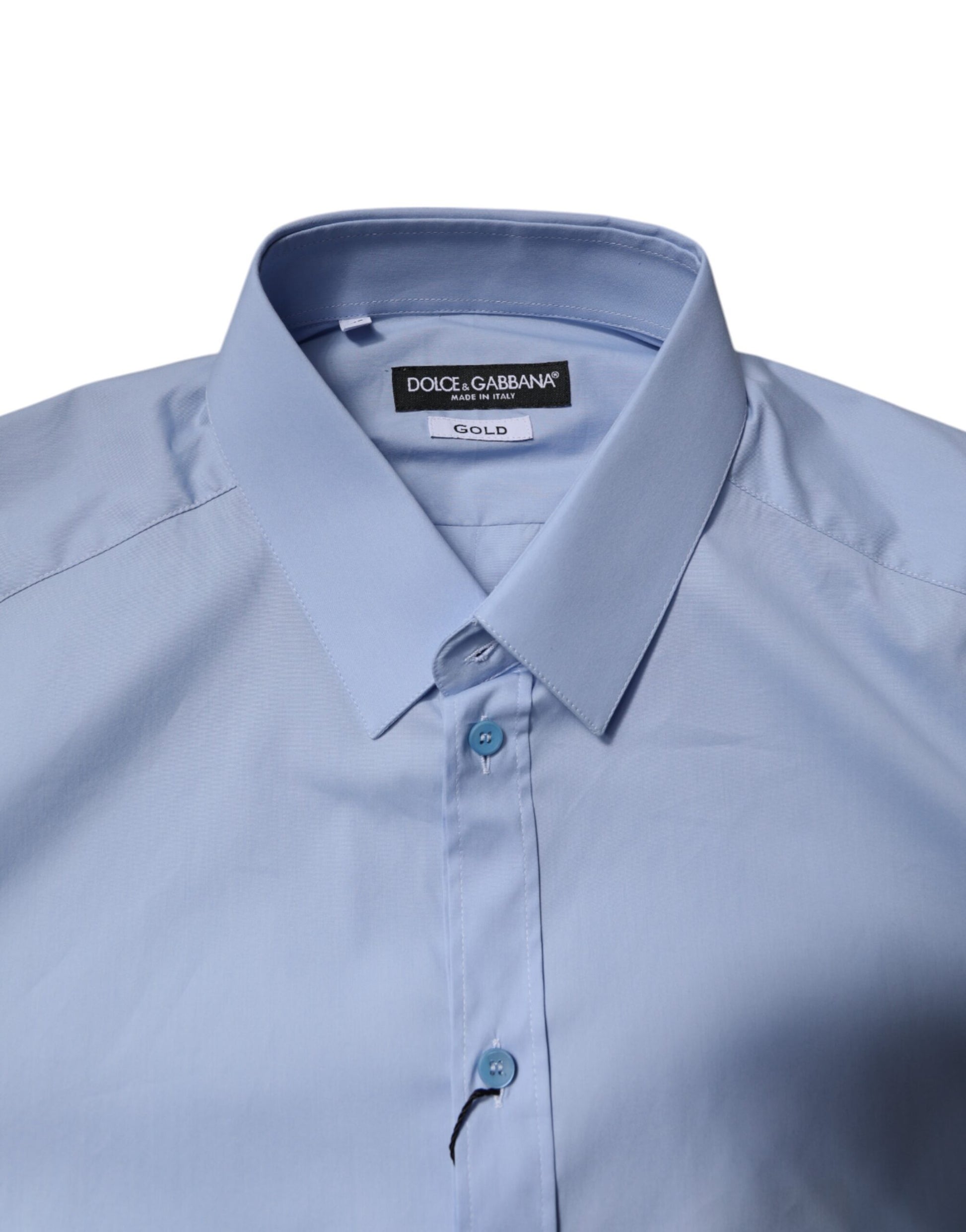 A light blue cotton dress shirt with a gold label from Dolce & Gabbana