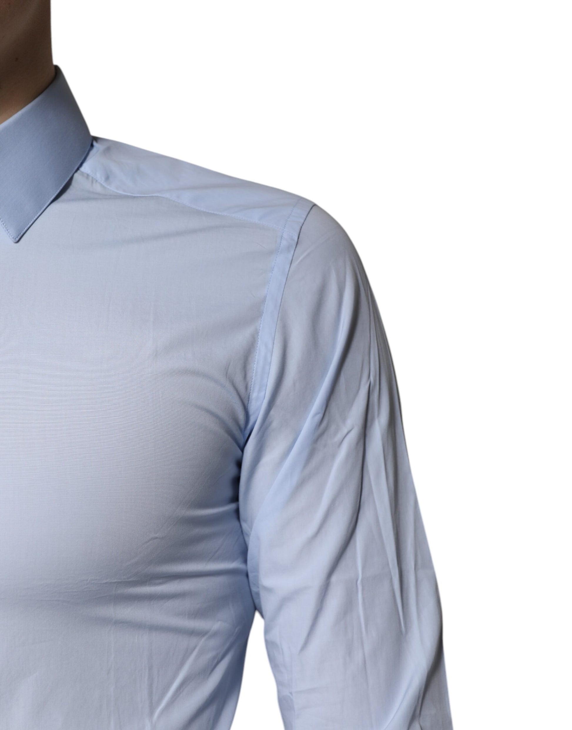 A light blue cotton dress shirt with gold accents, featuring a collar and short sleeves