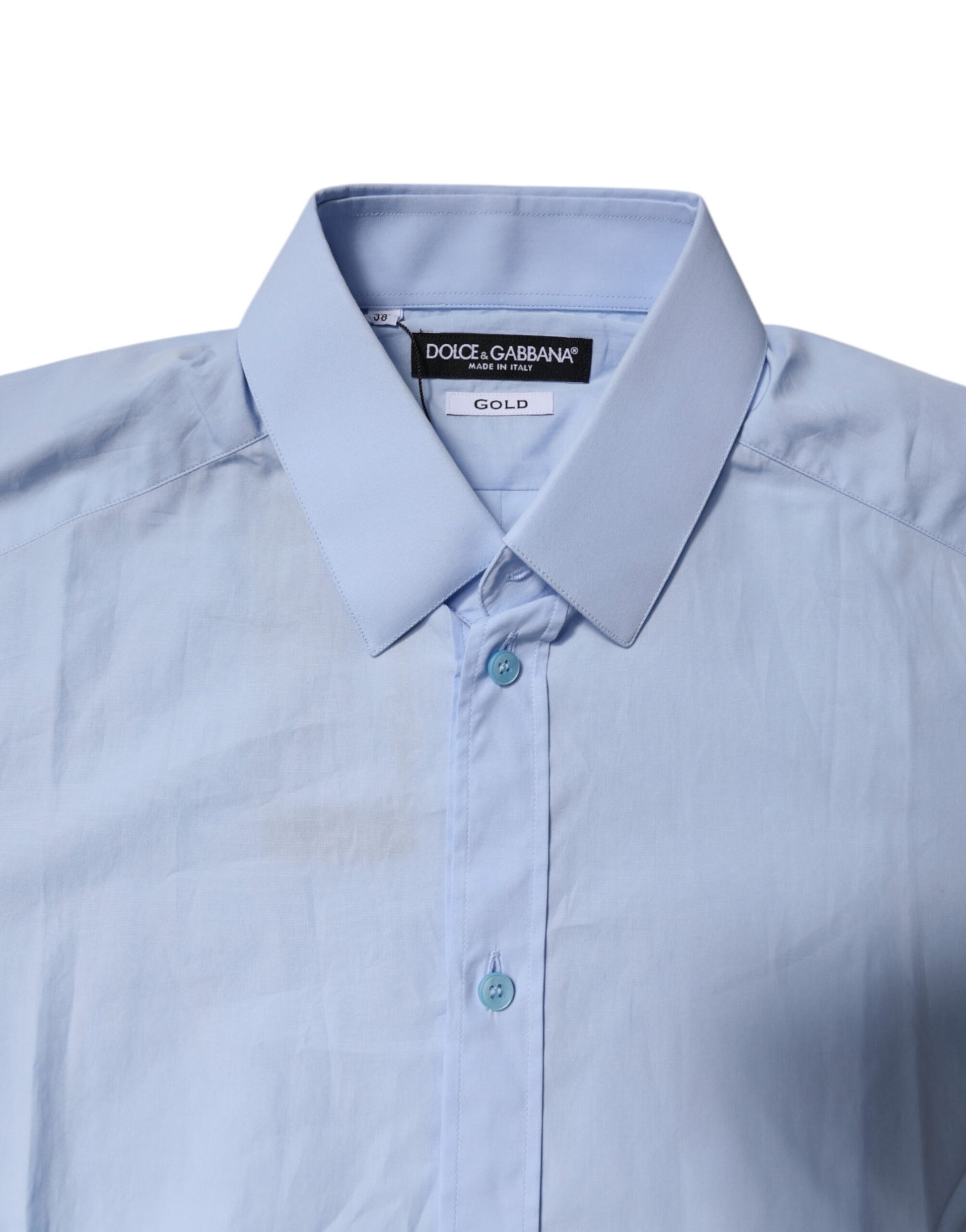 A light blue cotton dress shirt with gold accents, featuring a collar and buttons