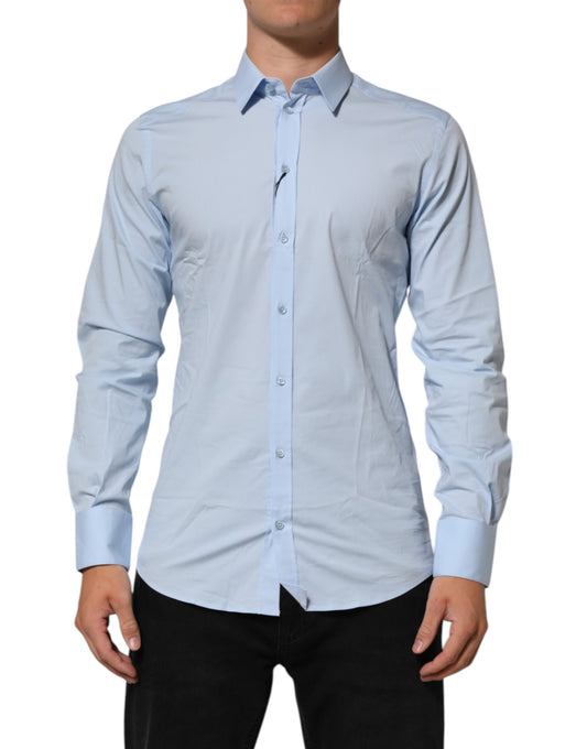 A light blue cotton dress shirt with gold accents, designed by Dolce & Gabbana