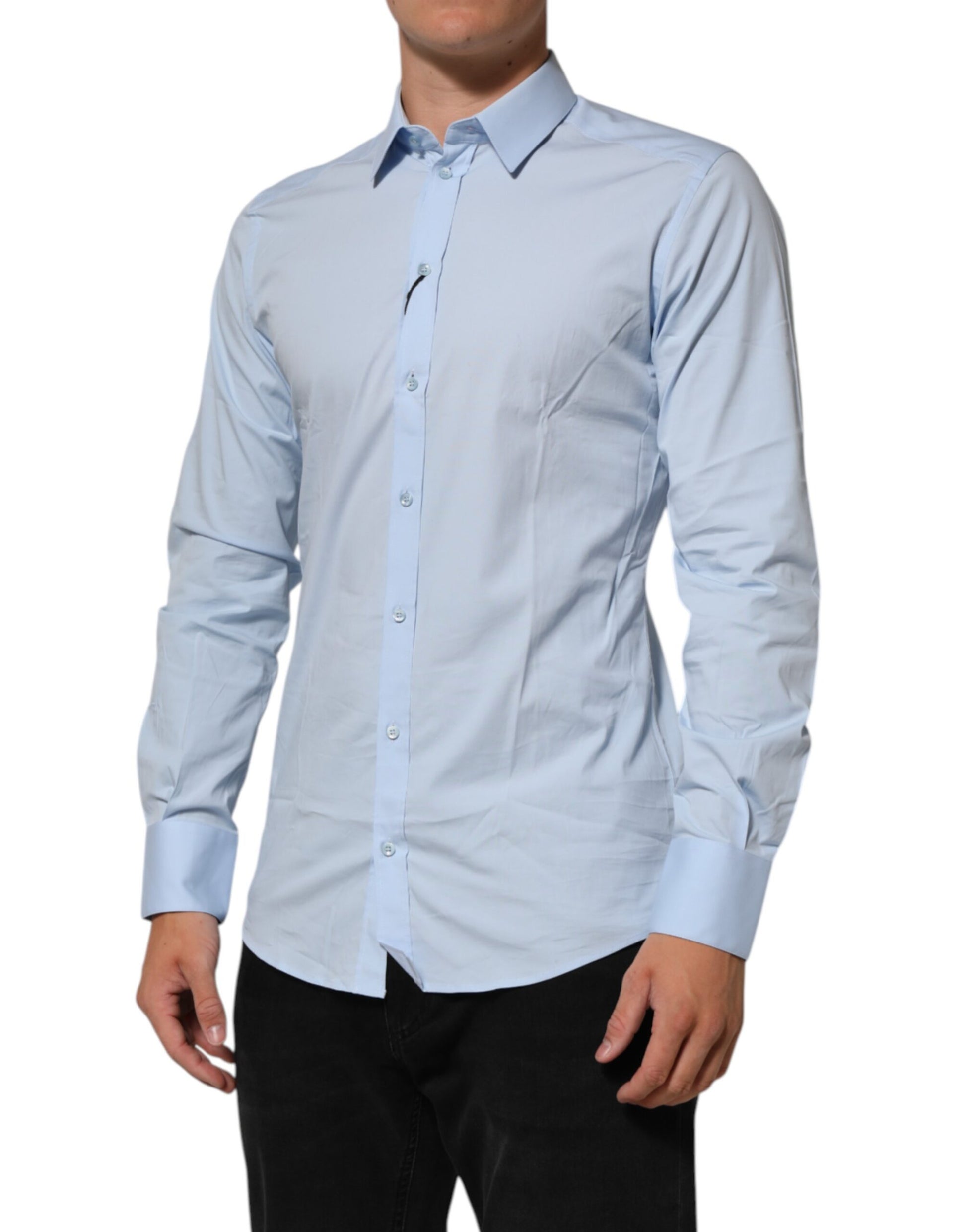 A light blue cotton dress shirt with long sleeves and a collar
