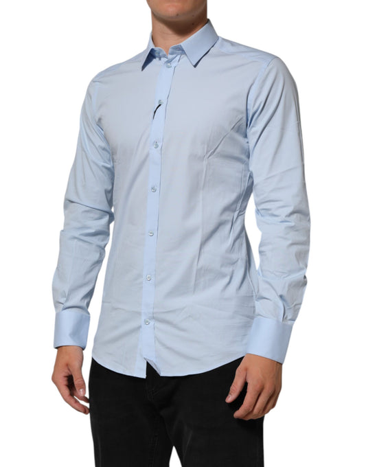 A light blue cotton dress shirt with long sleeves and a collar