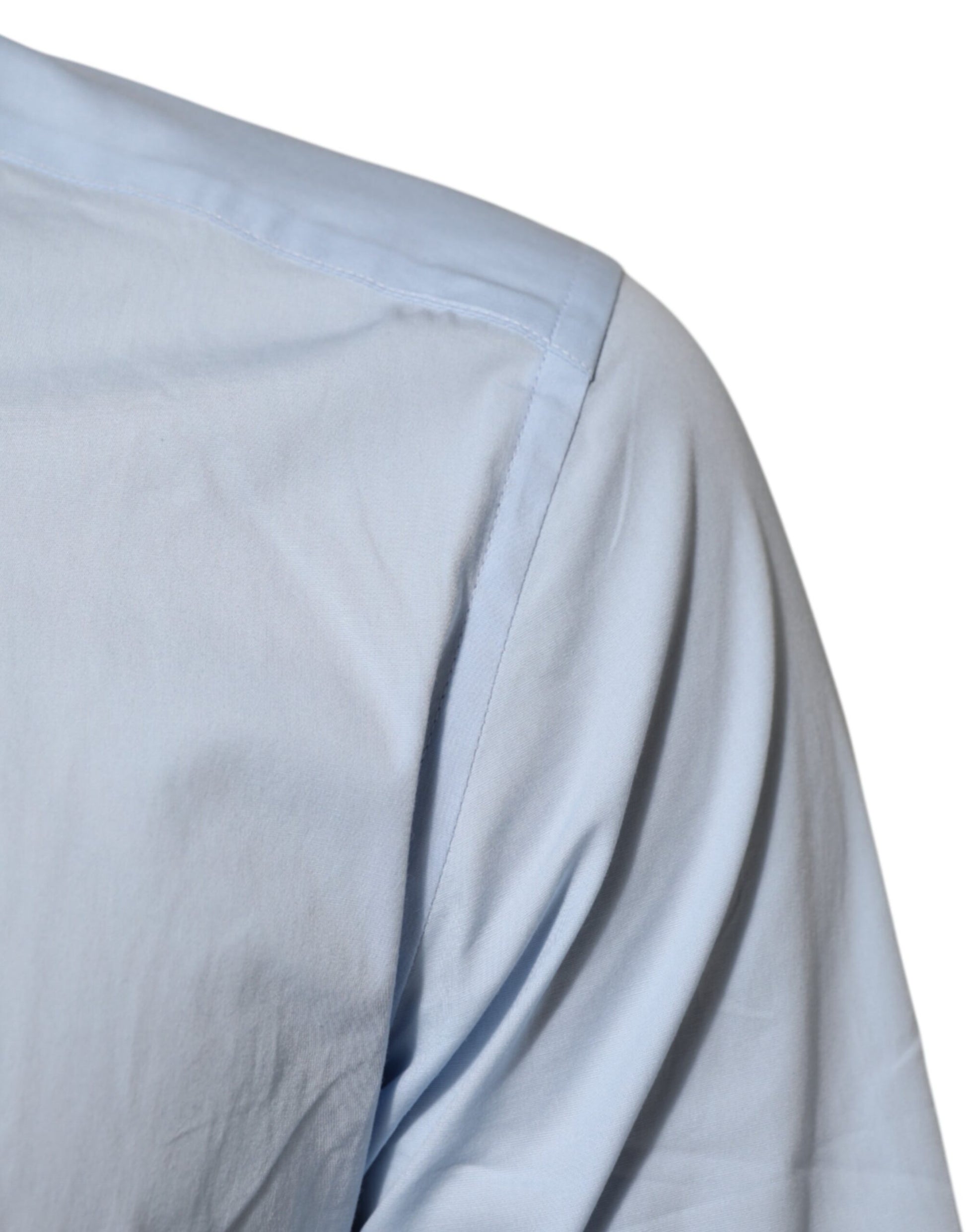 A light blue cotton dress shirt with a gold pattern on the sleeve