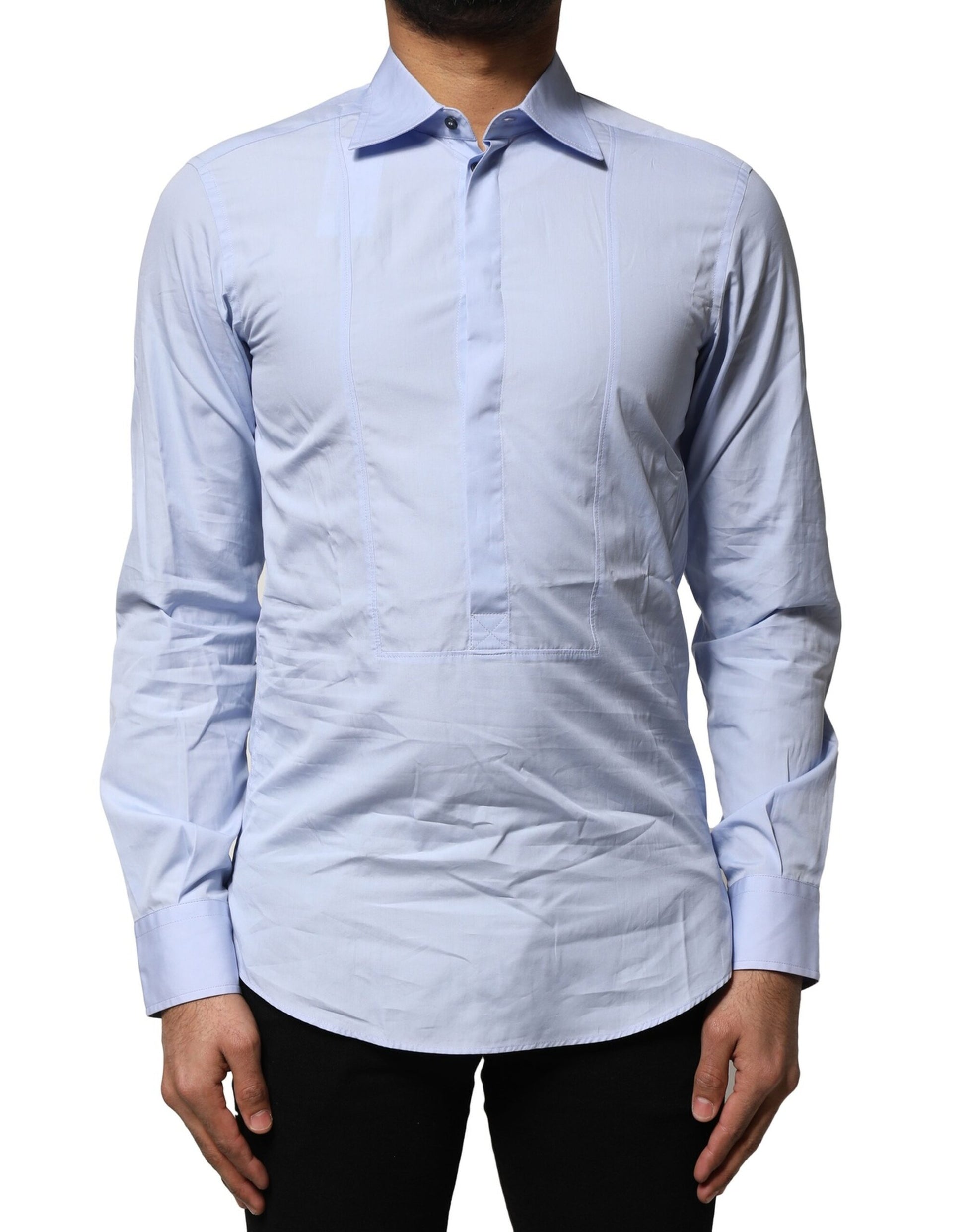 A long sleeve dress shirt in light blue cotton with a collar and button-down front