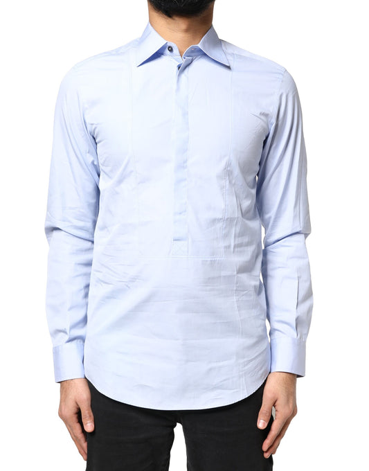 A long sleeve dress shirt in light blue cotton, with a collar and button-up front