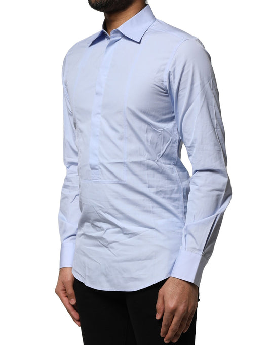 A long sleeve light blue dress shirt with a collar and button-up front