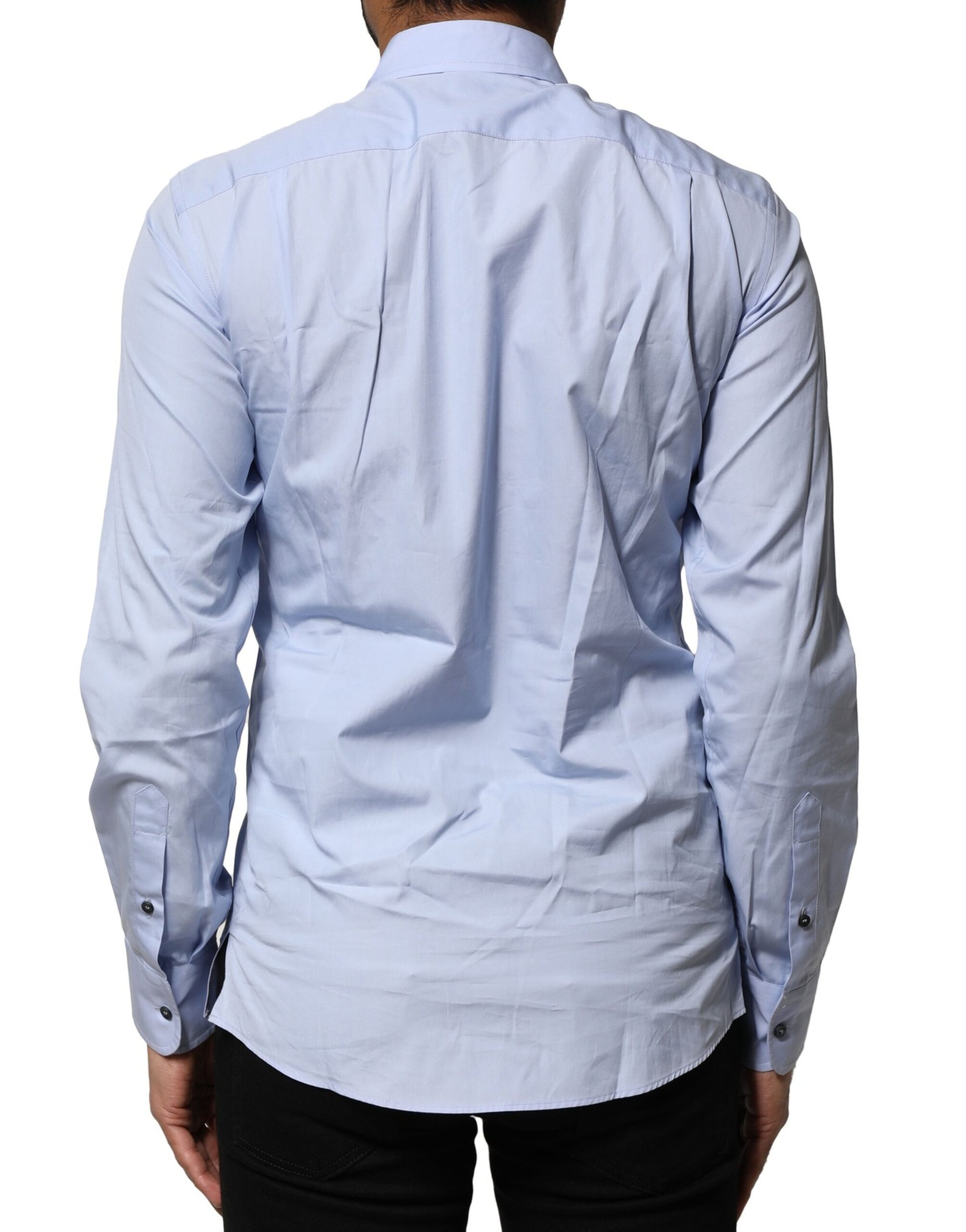A long sleeve dress shirt in light blue cotton with a collar and button-down front