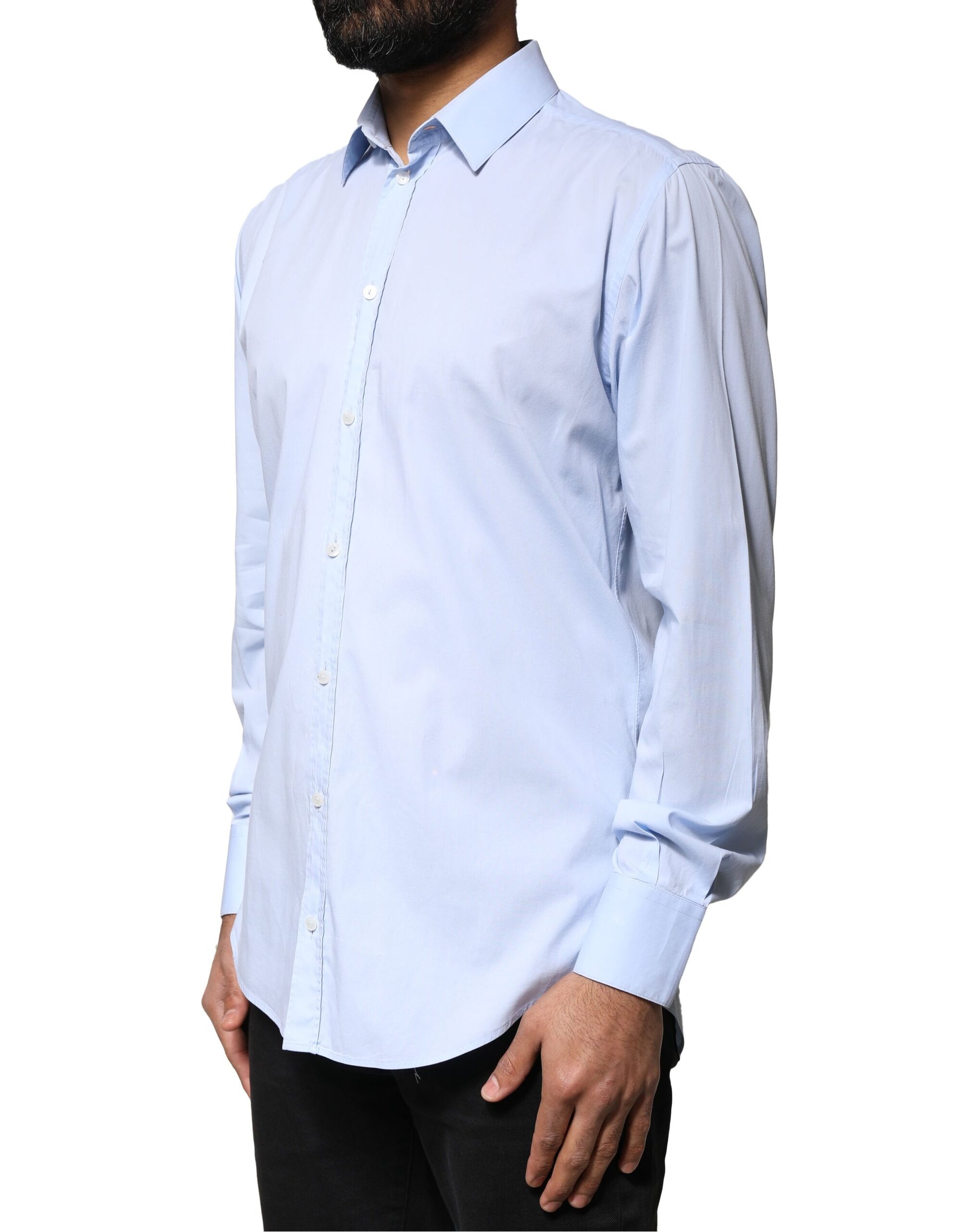 A light blue cotton dress shirt with long sleeves and a collar