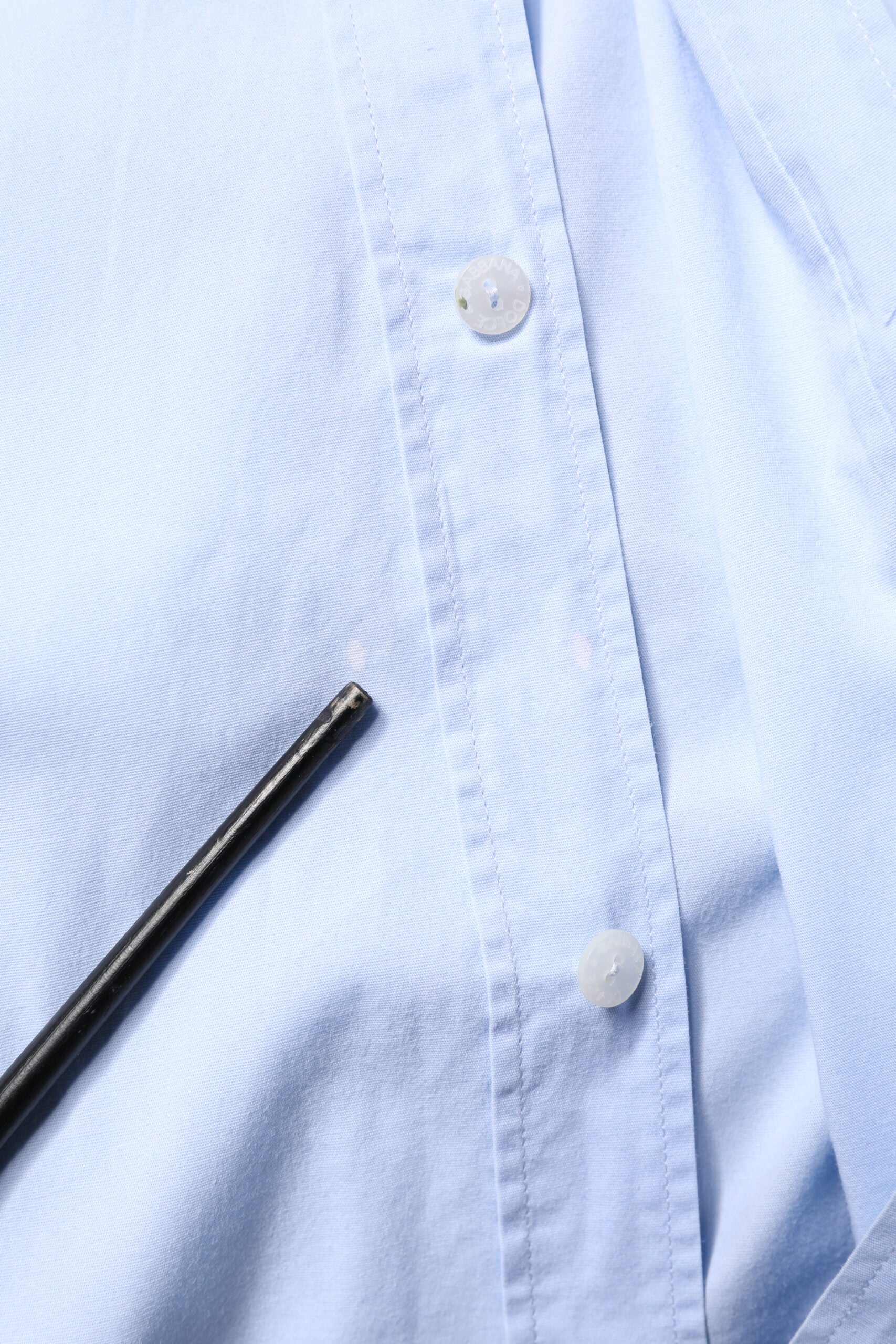A light blue cotton dress shirt with a collar and buttons, from the brand Dolce & Gabbana