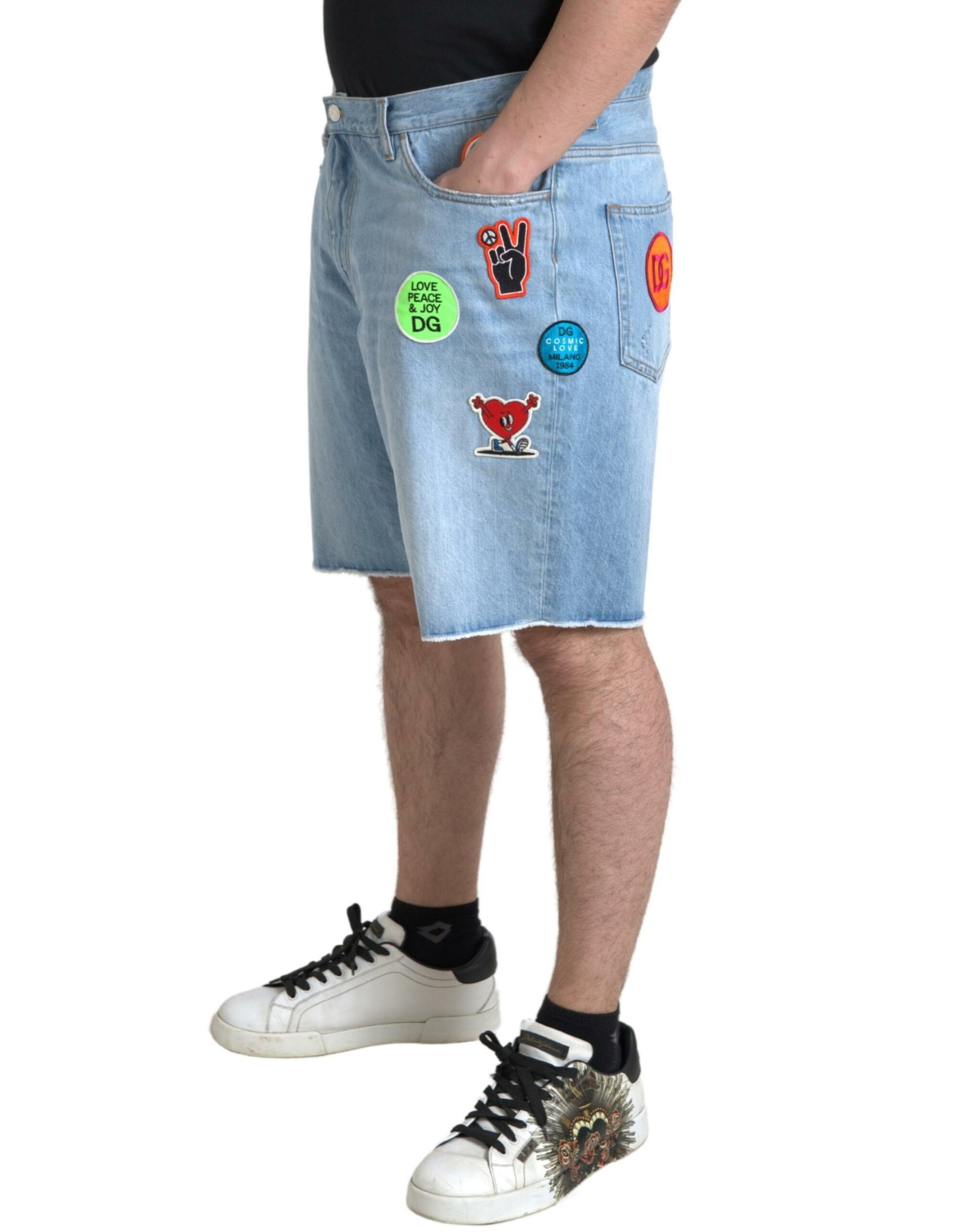 Man wearing denim shorts with stickers on them