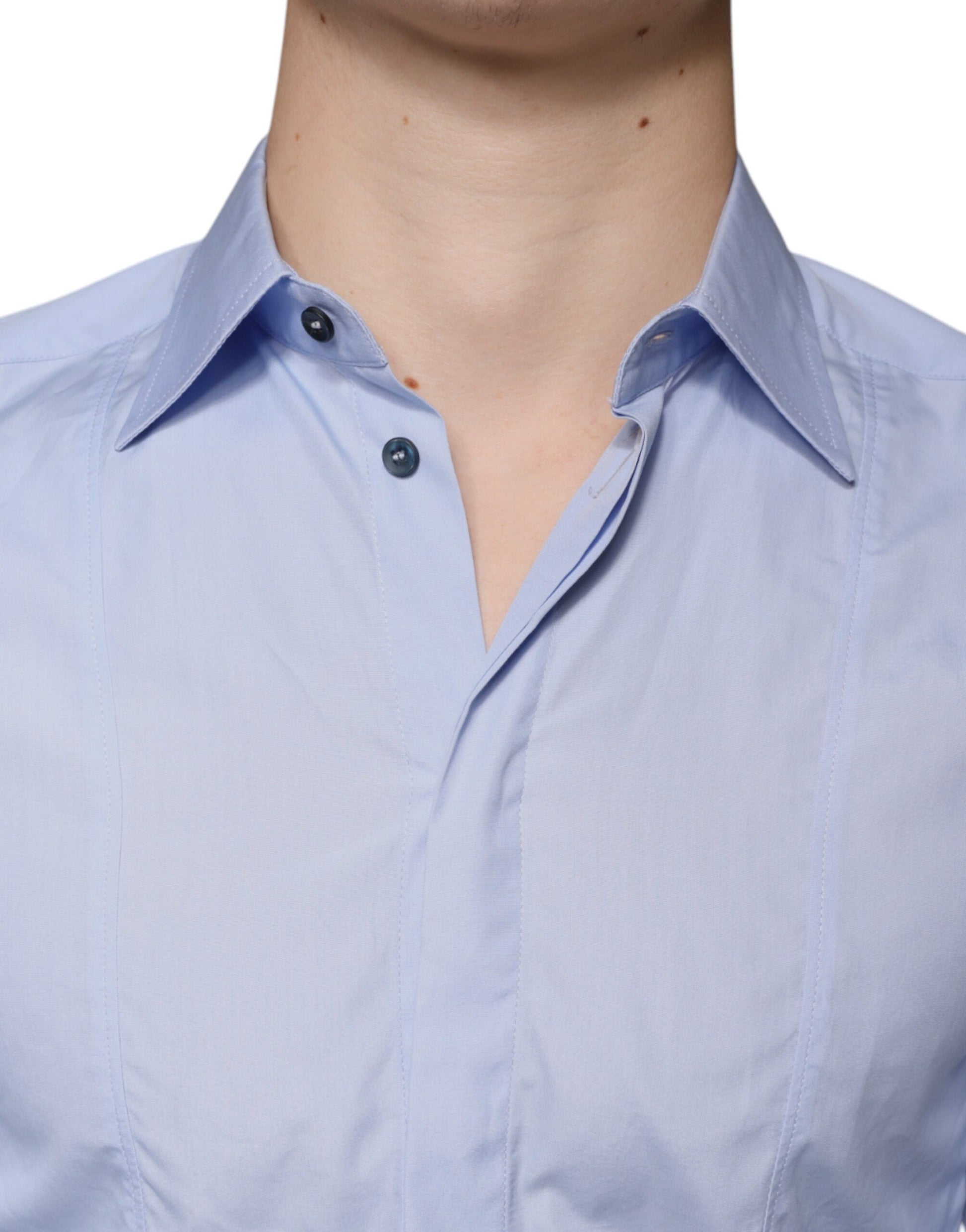 A light blue cotton men's dress shirt with a collar and buttons