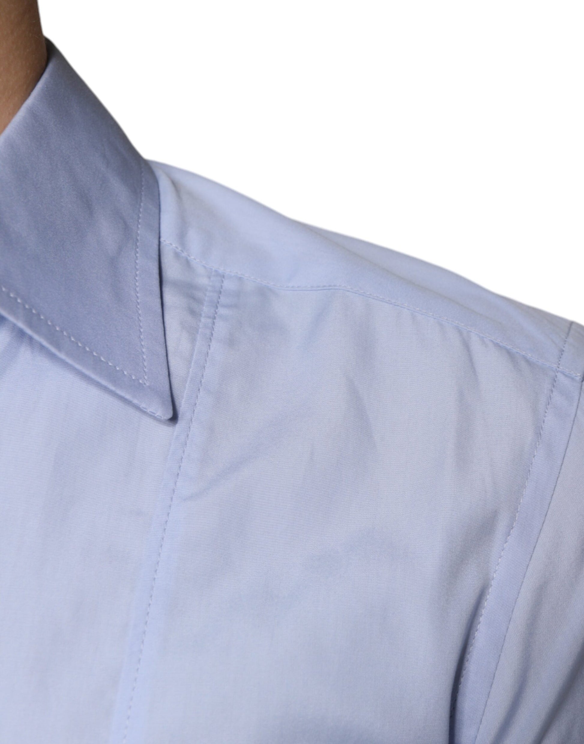 A light blue cotton men's dress shirt with a collar and button-up front