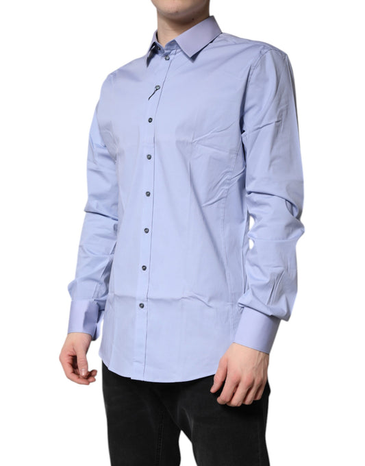A light blue cotton dress shirt with long sleeves and a collar
