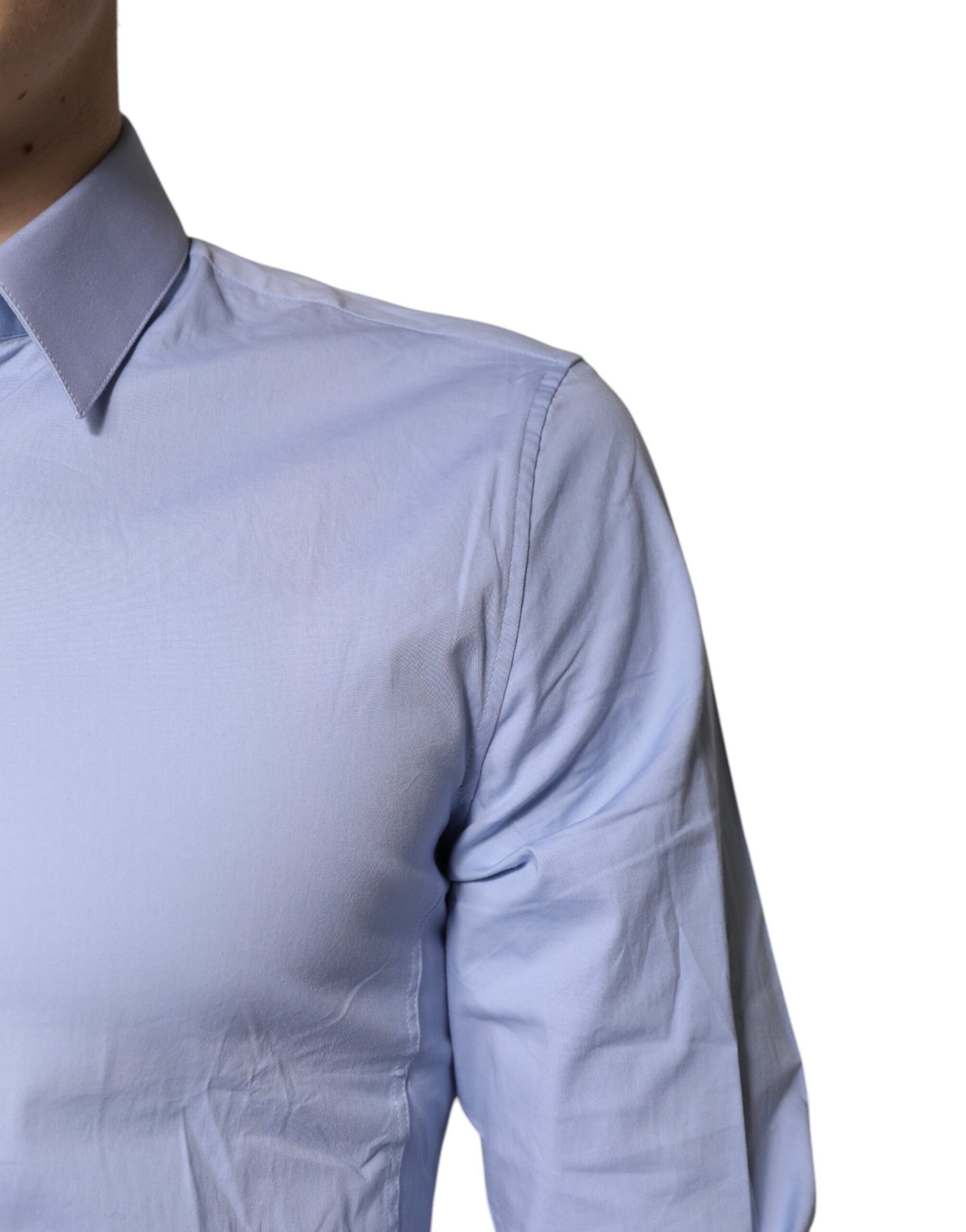 A light blue cotton dress shirt with long sleeves and a collar