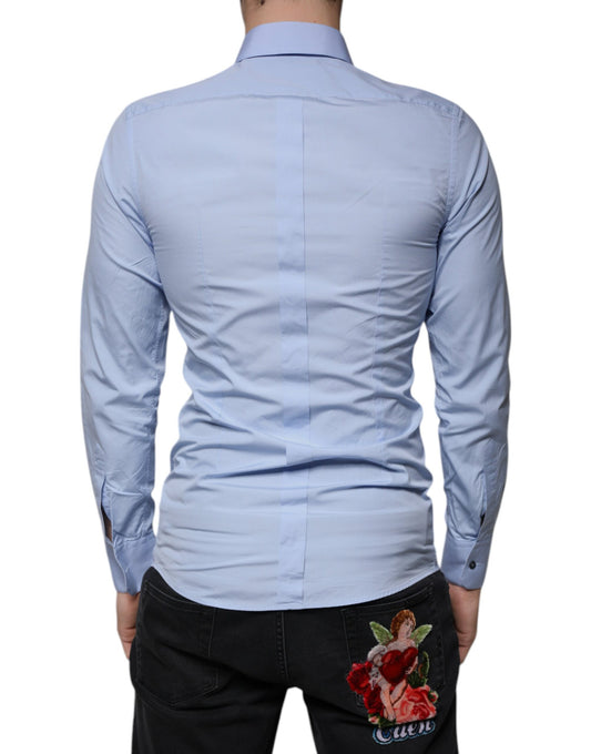 A light blue cotton dress shirt with a slim fit, featuring a gold design