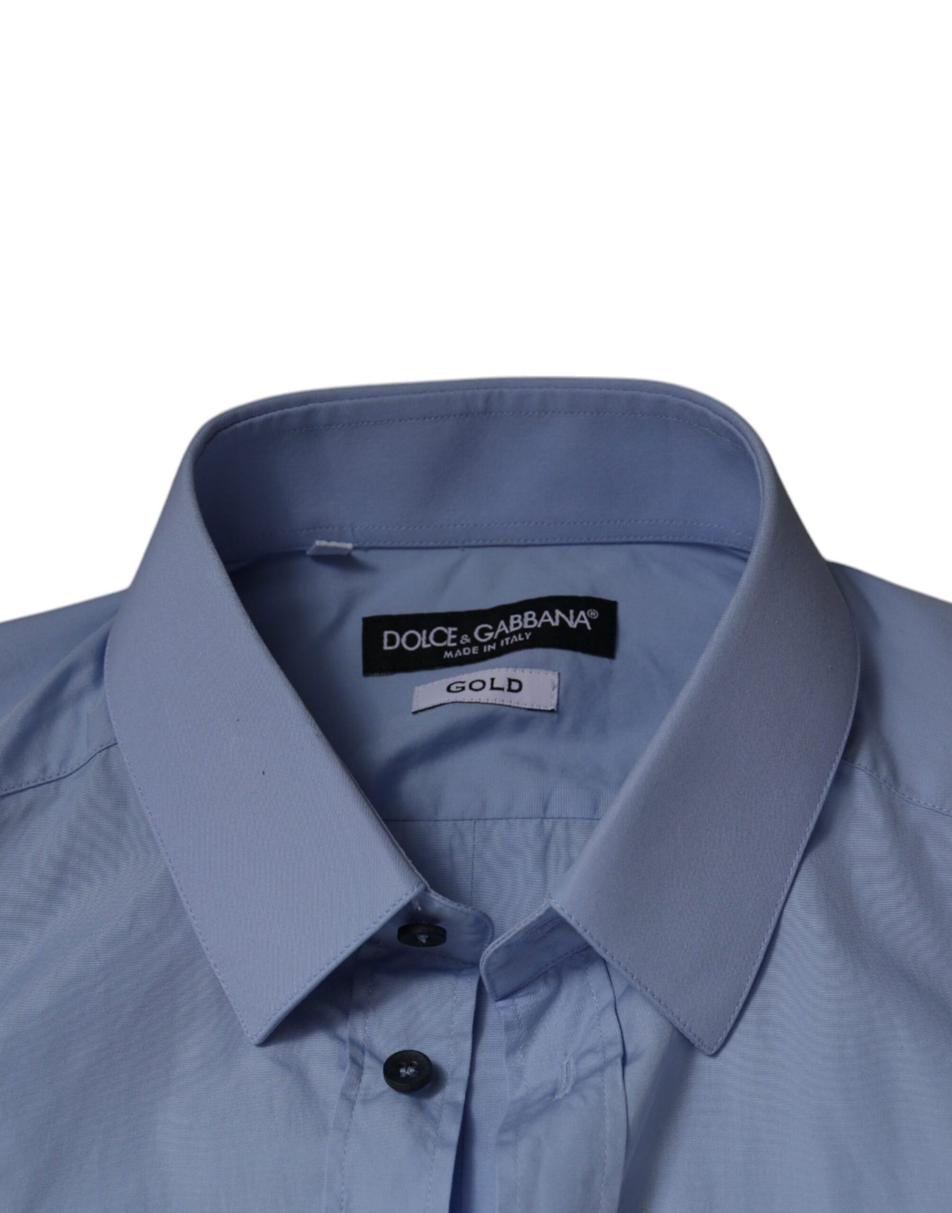 A light blue cotton dress shirt with a slim fit, featuring black buttons and a gold label