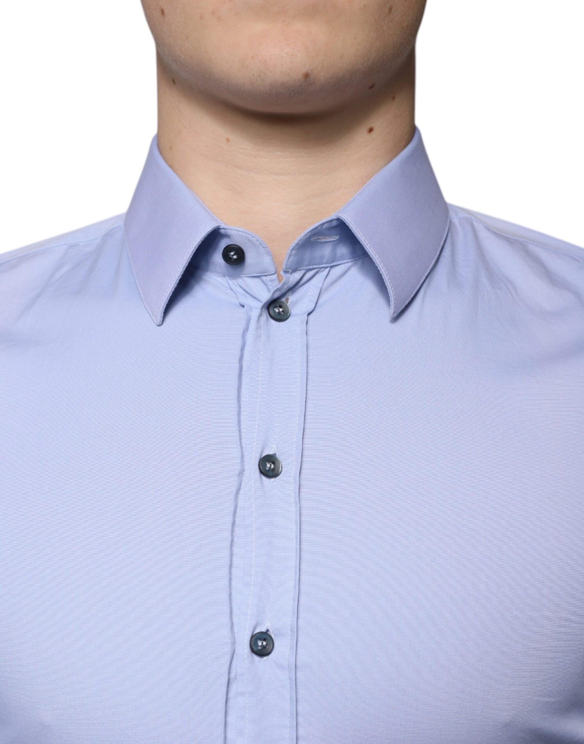 A light blue cotton dress shirt with a slim fit, featuring a Sicilia collar and two-button front