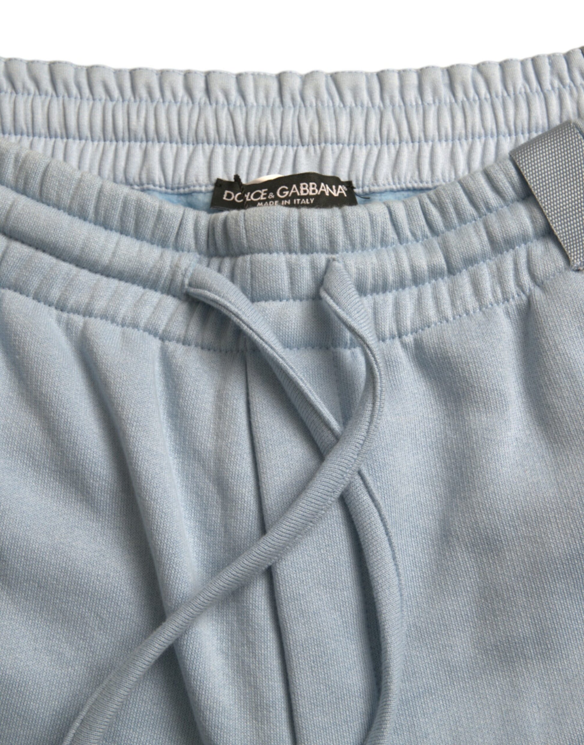 Pair of light blue men's pajama bottoms with drawstring waistband