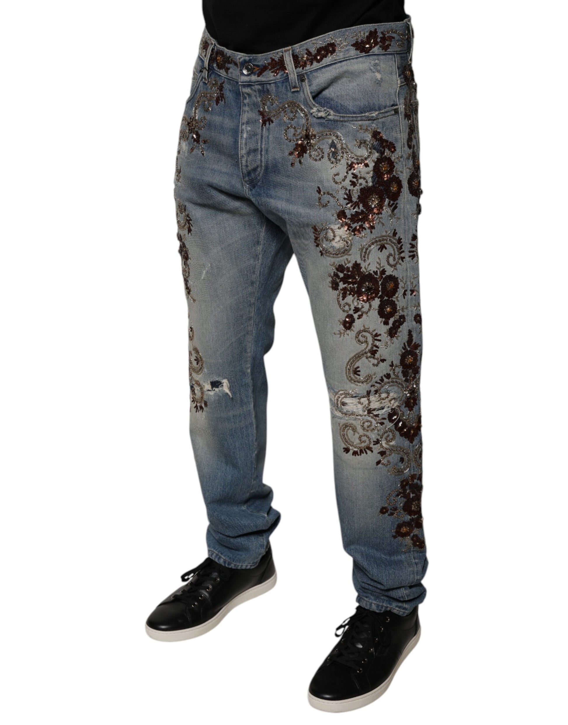 Man wearing blue jeans with distressed design