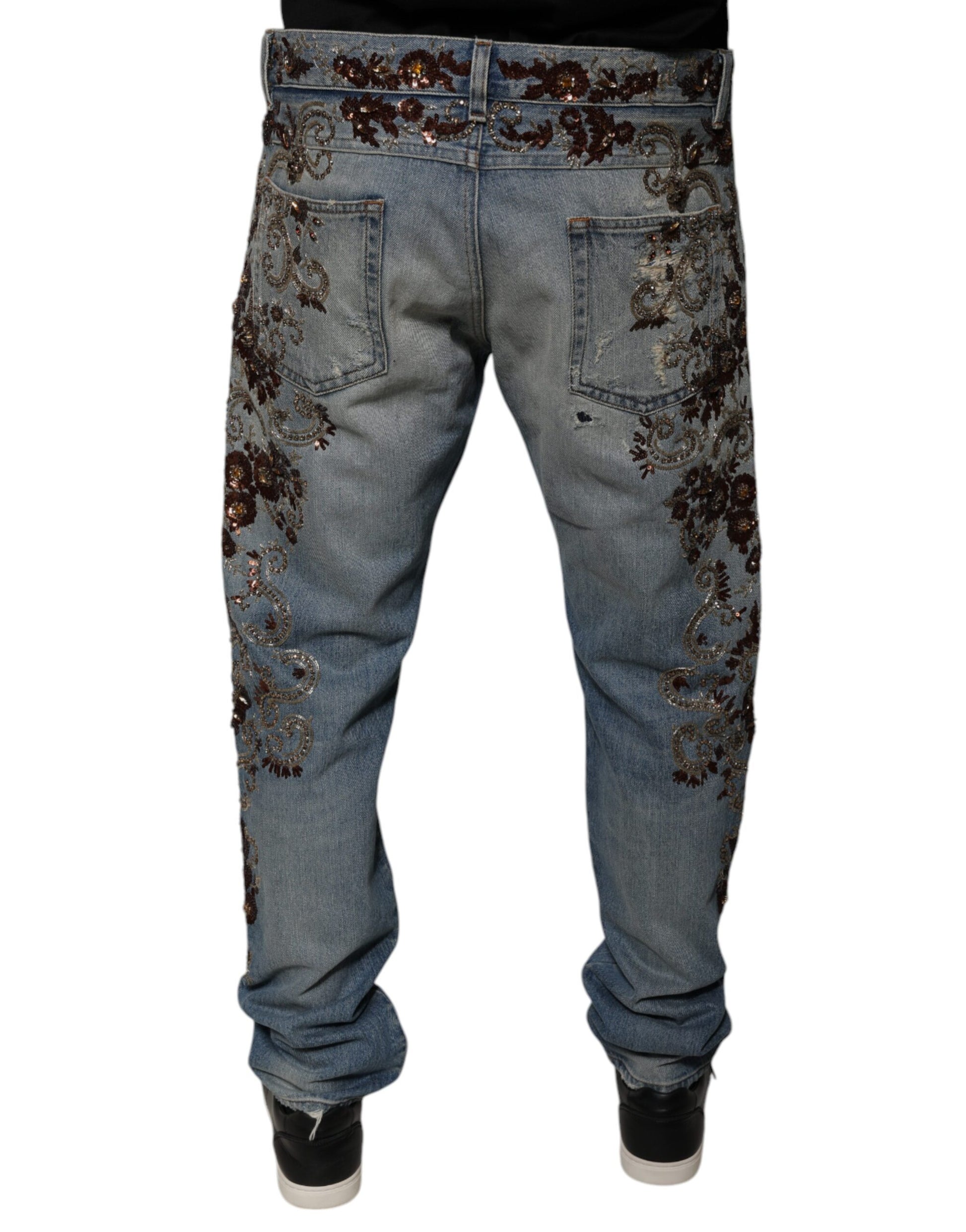 Pair of blue jeans with floral embroidery on legs