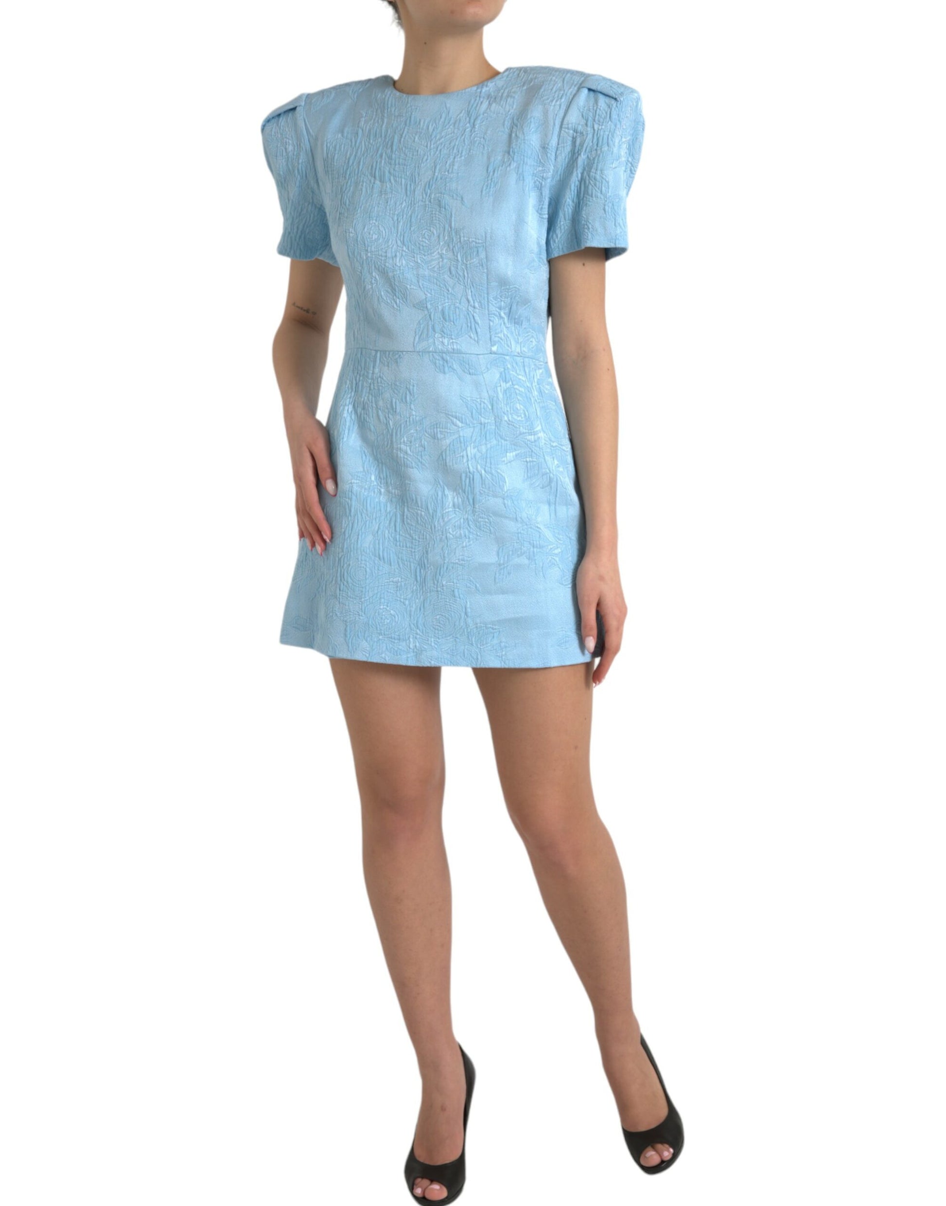 A short, sleeveless dress with a floral pattern and puffed shoulders