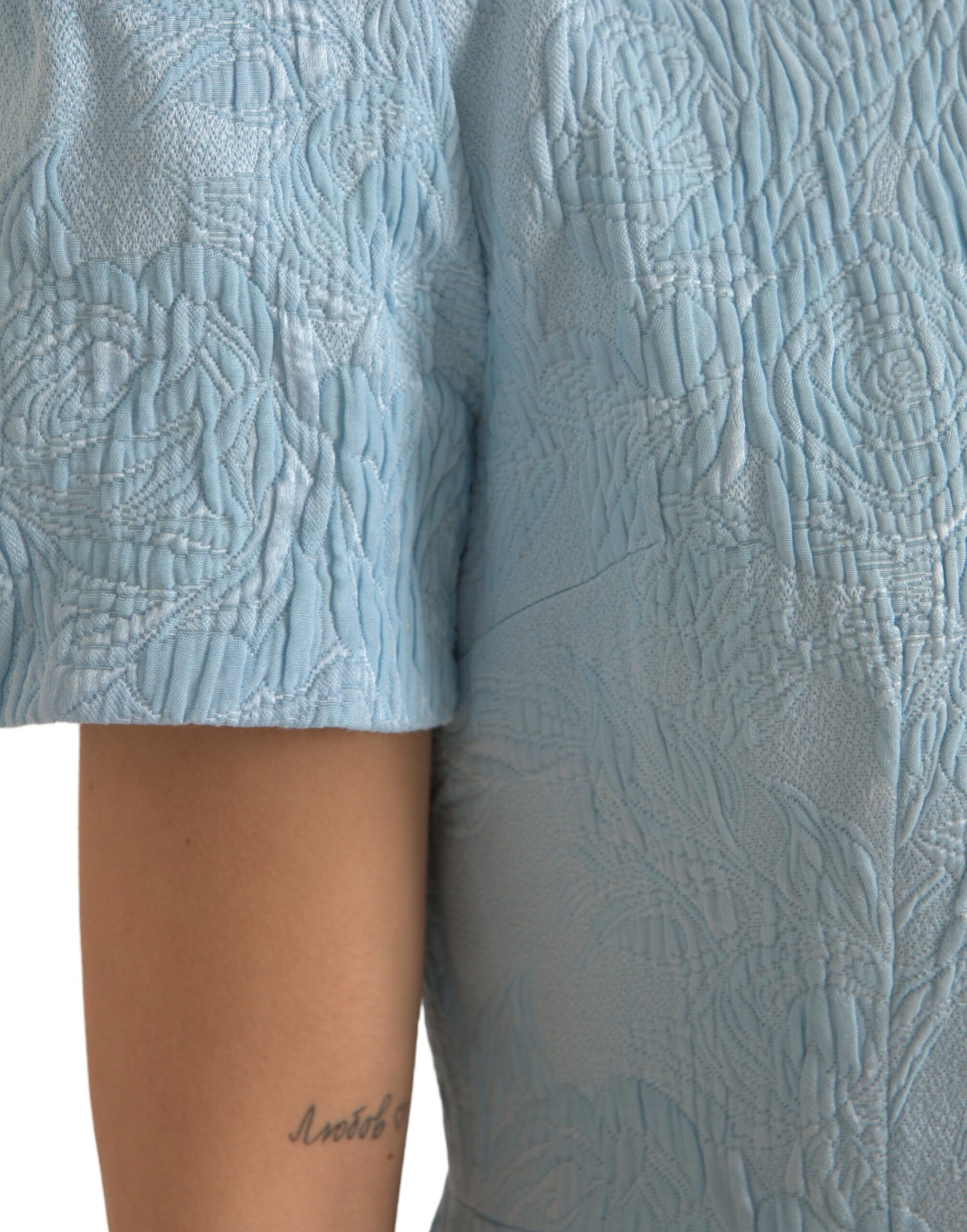 A light blue floral jacquard dress with puff sleeves