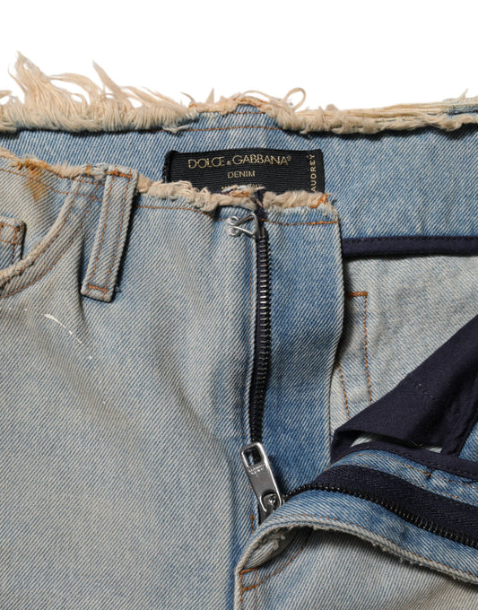 Blue denim jeans with frayed hem and zipper