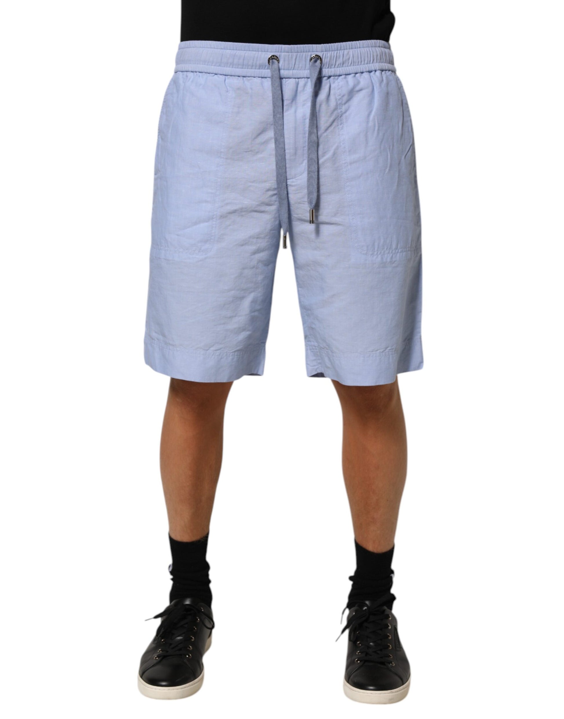Man wearing light blue shorts