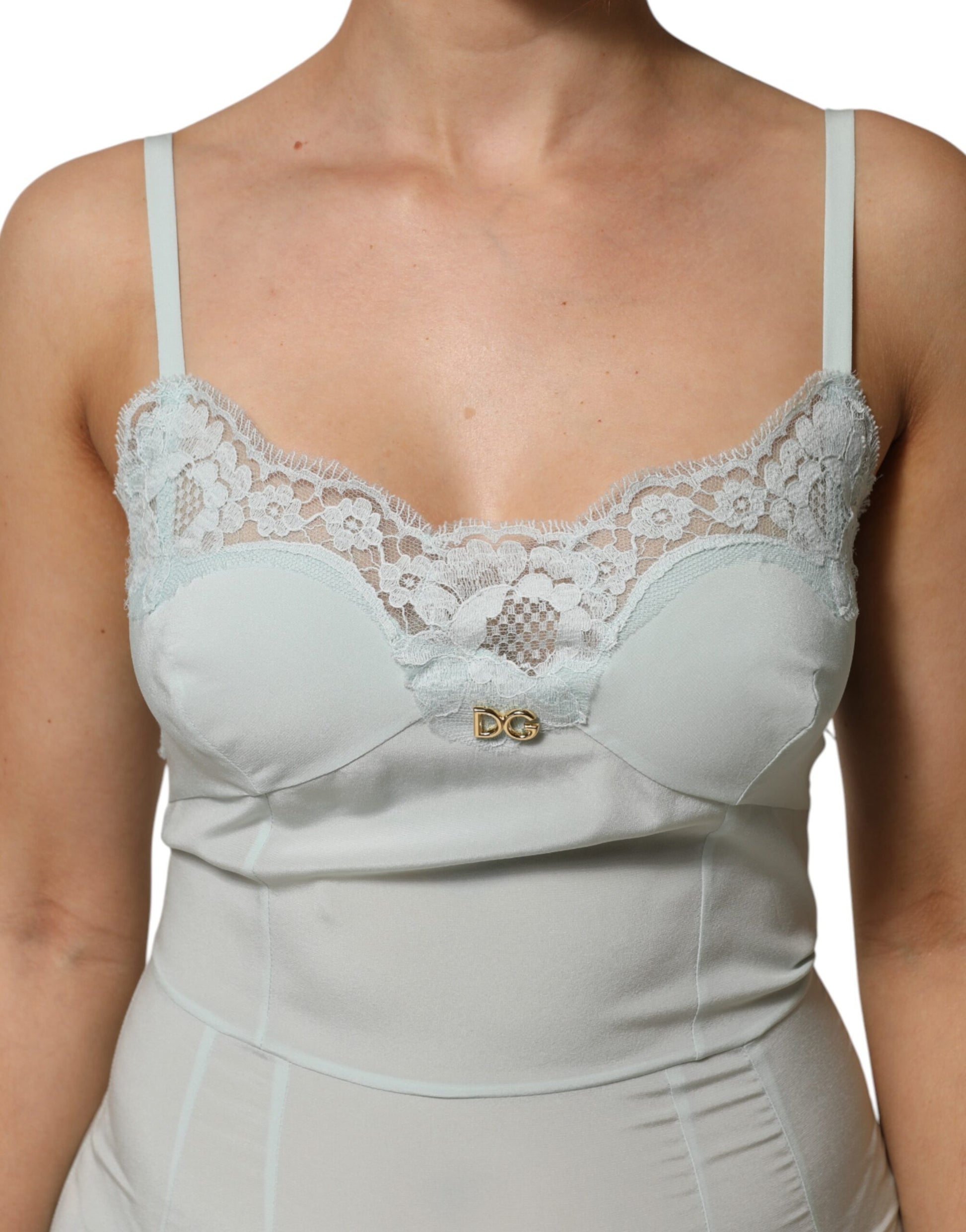 A light blue silk lace midi bodycon slip dress with a gold button