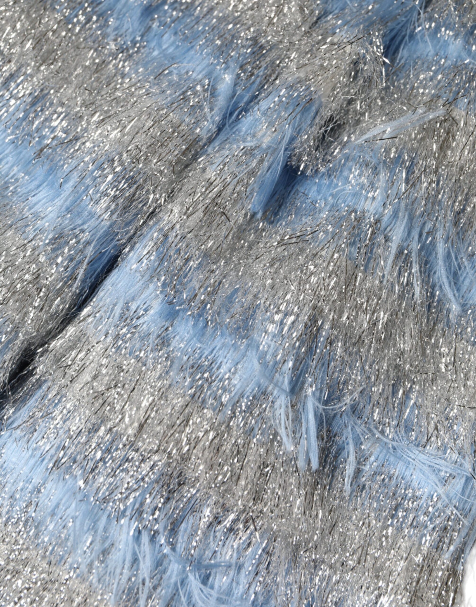 A close-up of a light blue and silver jacquard dress with an A-line silhouette