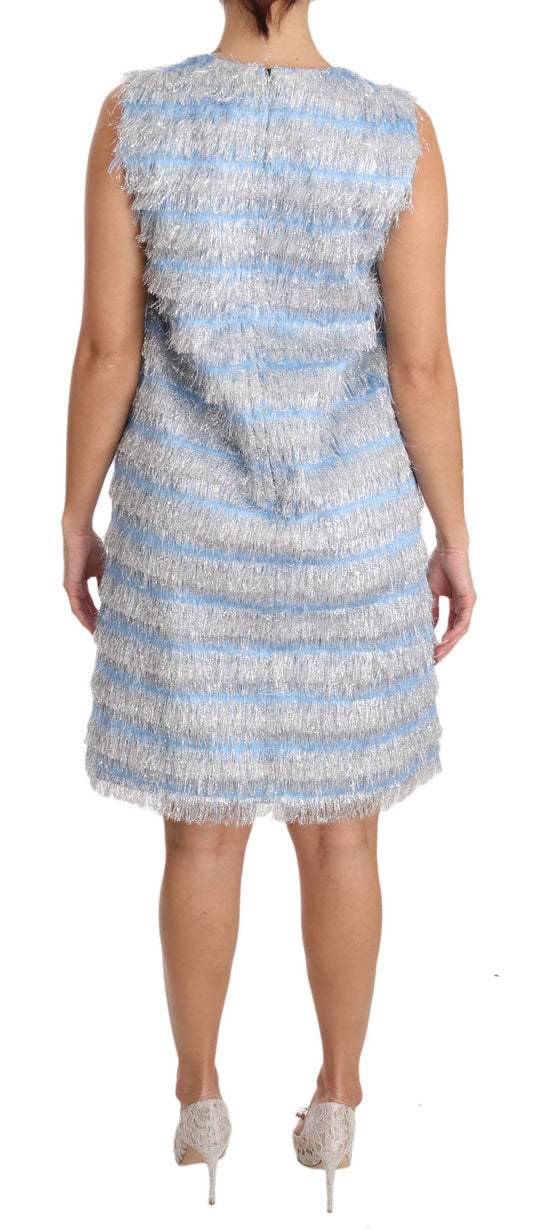 A woman's dress with a light blue and silver patterned design, featuring a shift silhouette