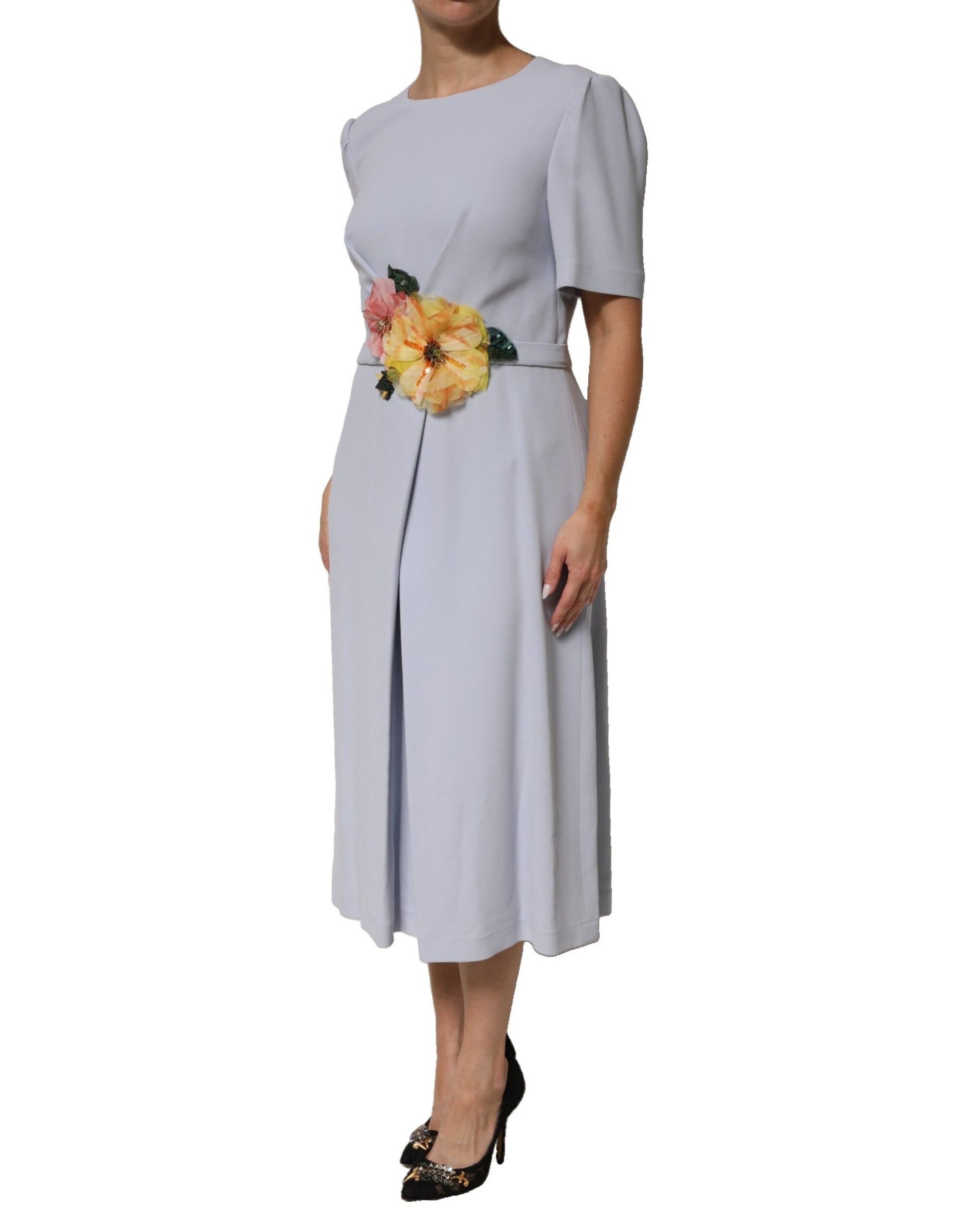 A light blue dress with floral applique on the bodice and a flared skirt