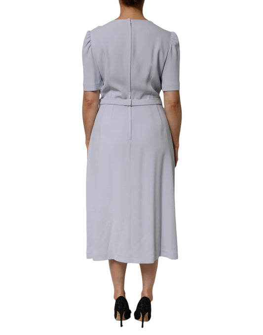 A light blue dress with floral appliques and a viscose blend fabric