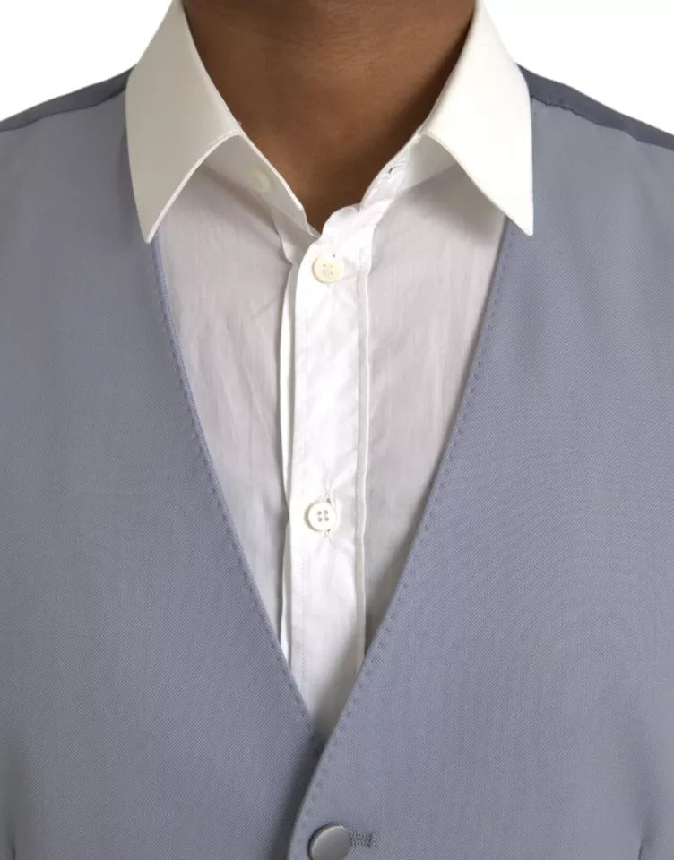 A light blue wool vest with a button-up front, part of a formal dress ensemble