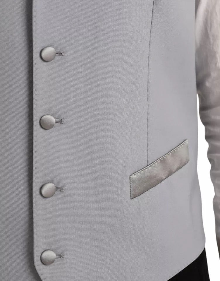 A light blue wool vest with three buttons, part of a formal dress waistcoat