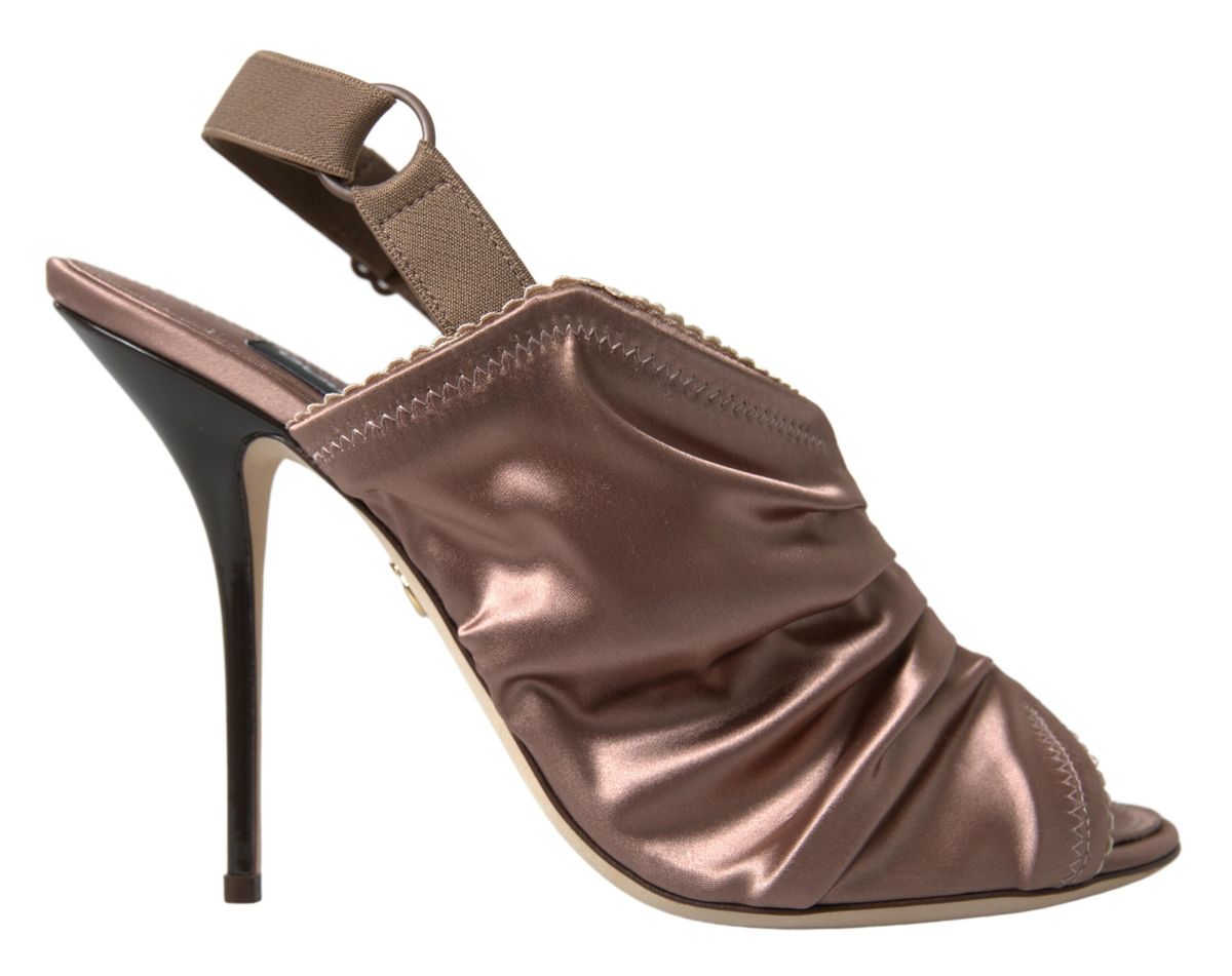 High heel shoe with a strap over the foot and a bow on the ankle