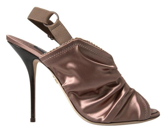 High heel shoe with a strap over the foot and a bow on the ankle