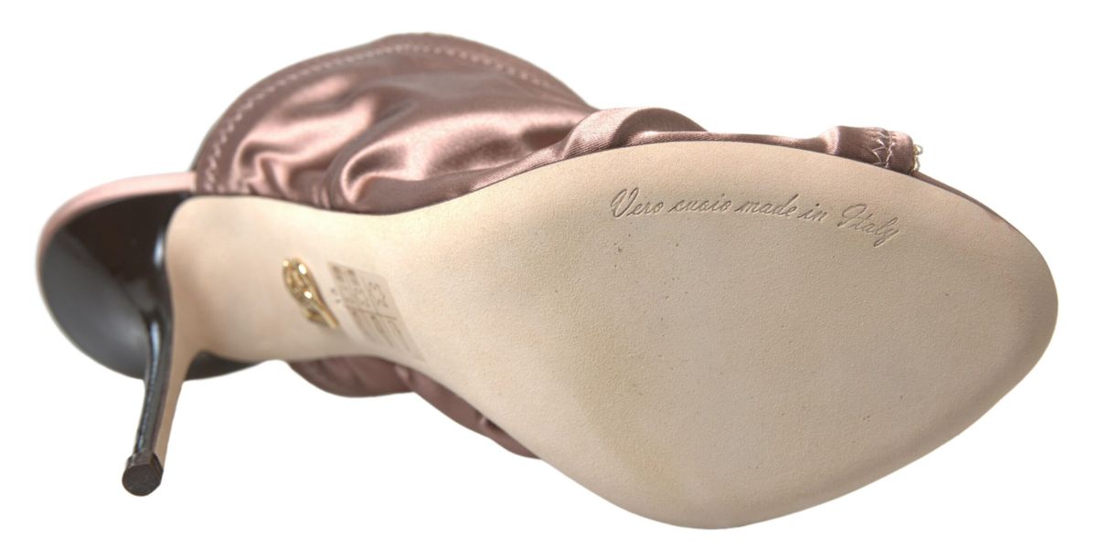 Pair of women's high heel shoes with pink satin toe cap and bow detail